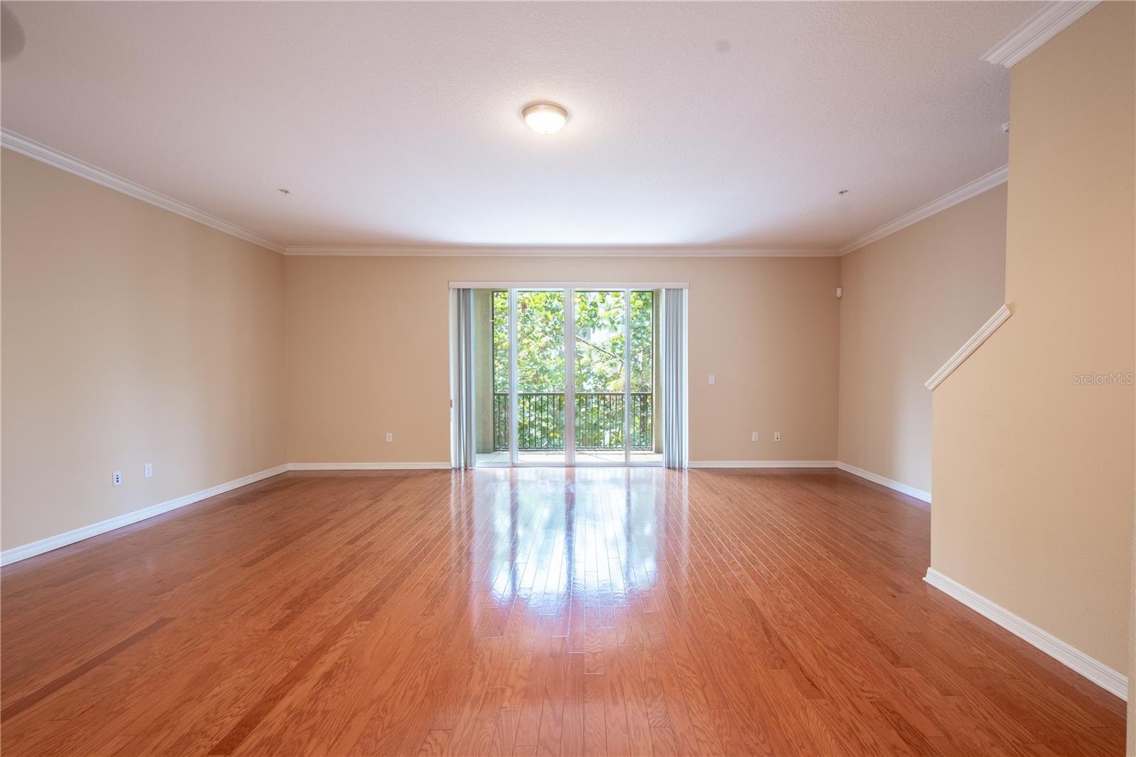 Sliding glass doors in the living and dining area open up to a serene view, letting nature become the perfect backdrop to your everyday life.