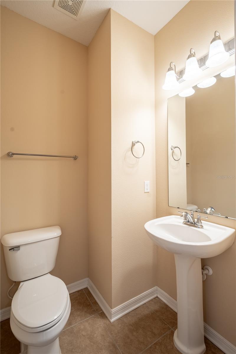 A convenient half bath is located in the main living area.