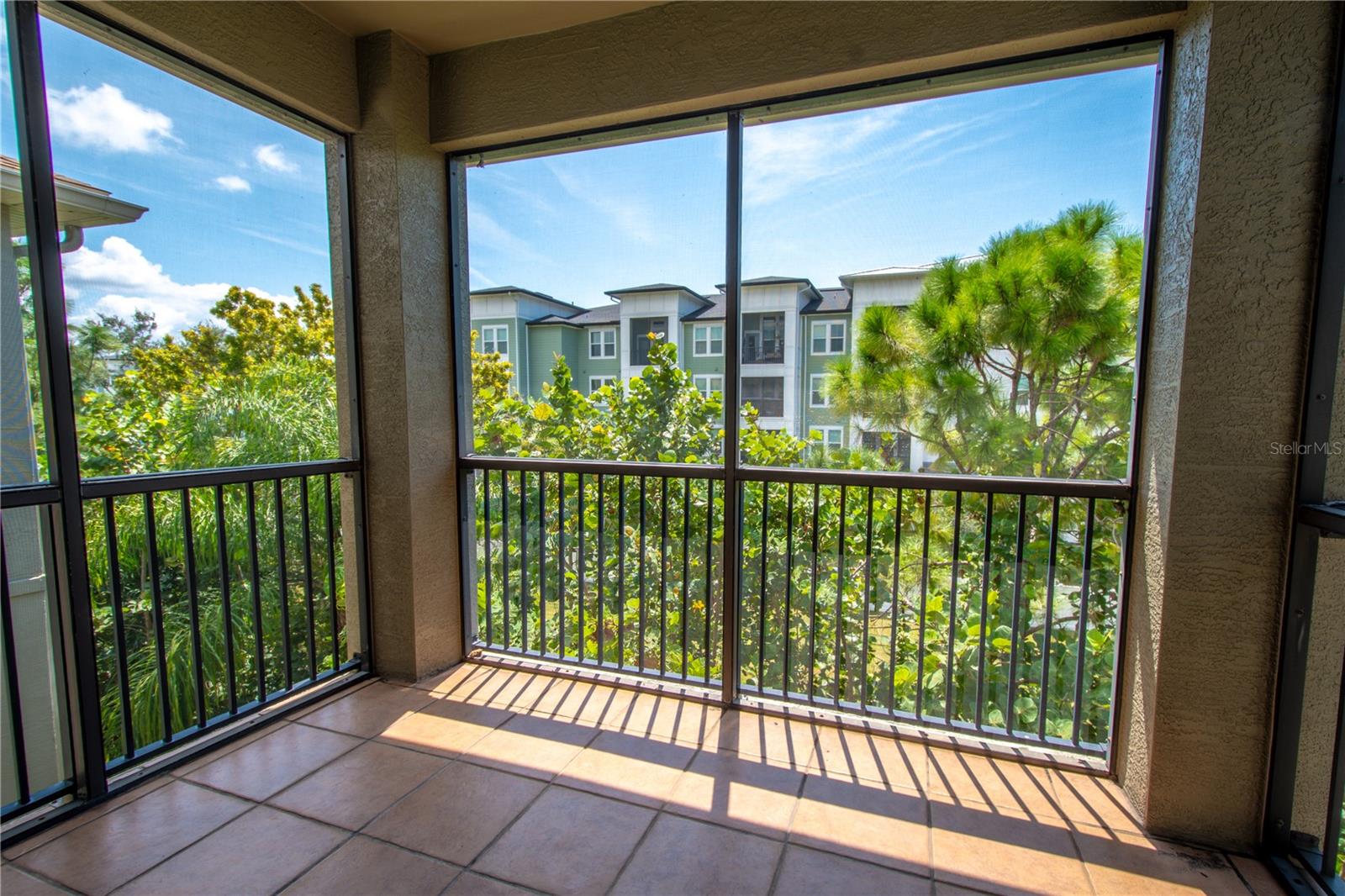 Sliding glass doors in the primary bedroom open up to your own private balcony, perfect for enjoying a quiet morning or a peaceful evening under the stars.