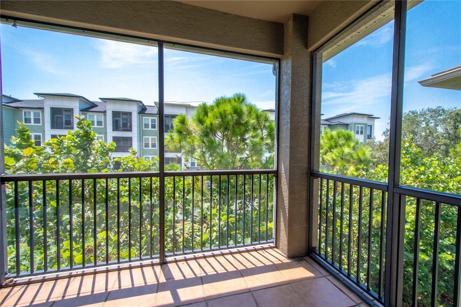 Step out onto the private balcony, where the peaceful surroundings make you feel like you're nestled in a cozy treehouse, perfect for a quiet escape.