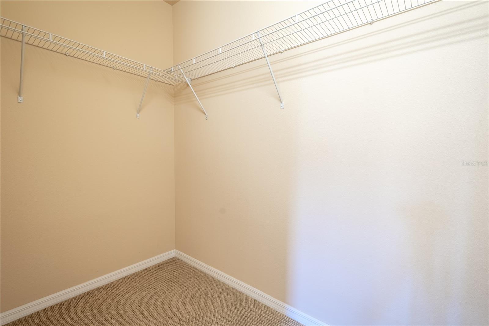 Primary Bedroom walk-in closet.