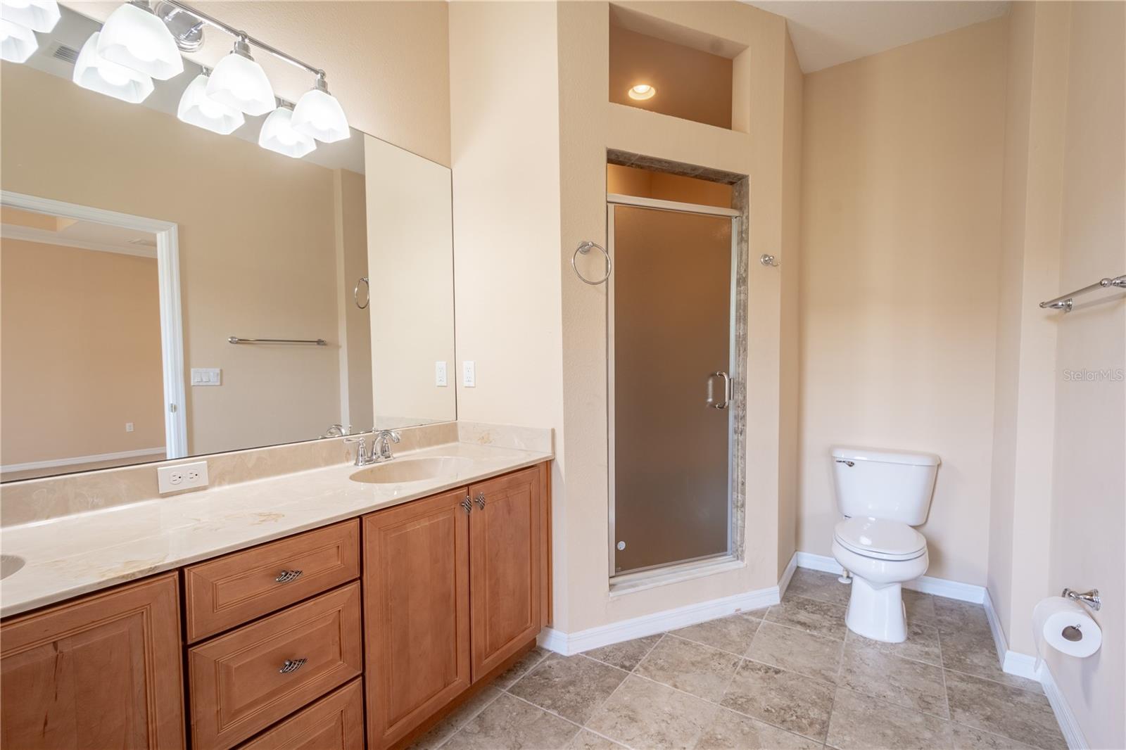 The primary ensuite features a separate walk-in shower.