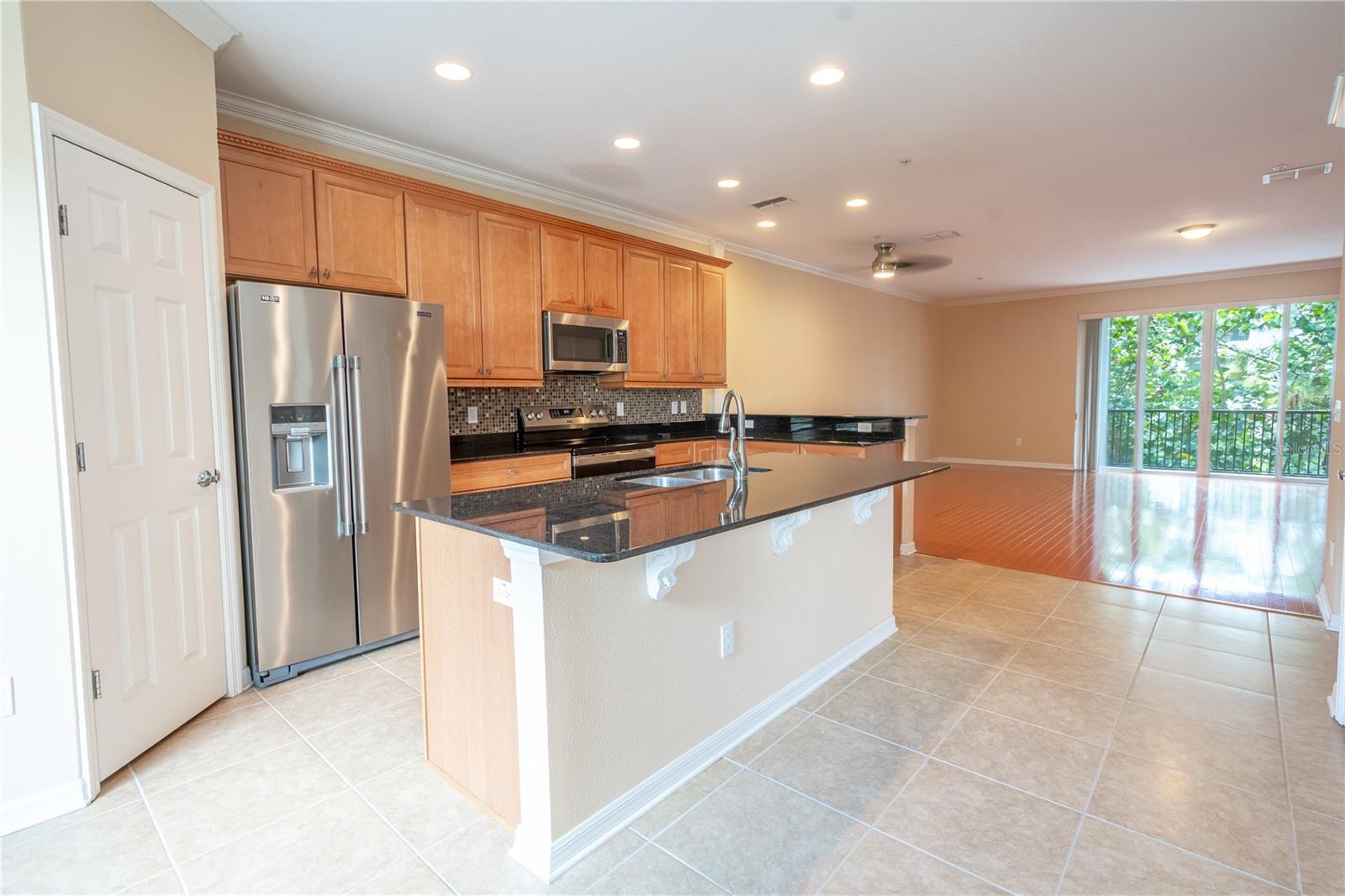 The kitchen opens to the dining and living rooms.