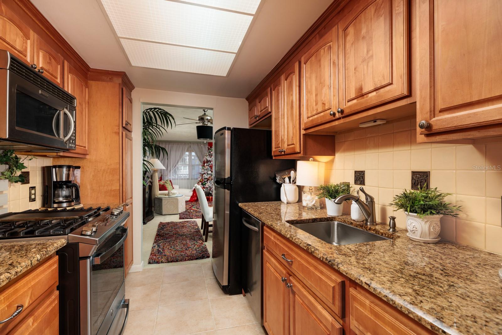 Kitchen w/Gas range & pantry w/Pull out drawers.