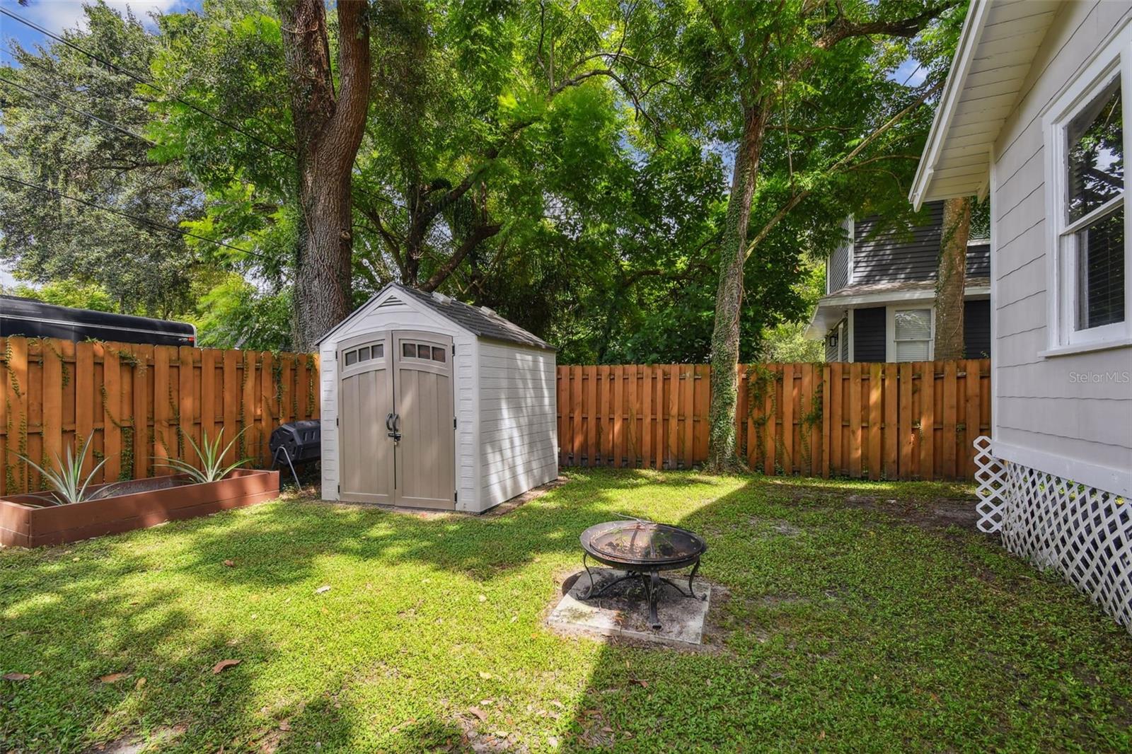 Backyard with Storage Shed and Gardening Bed