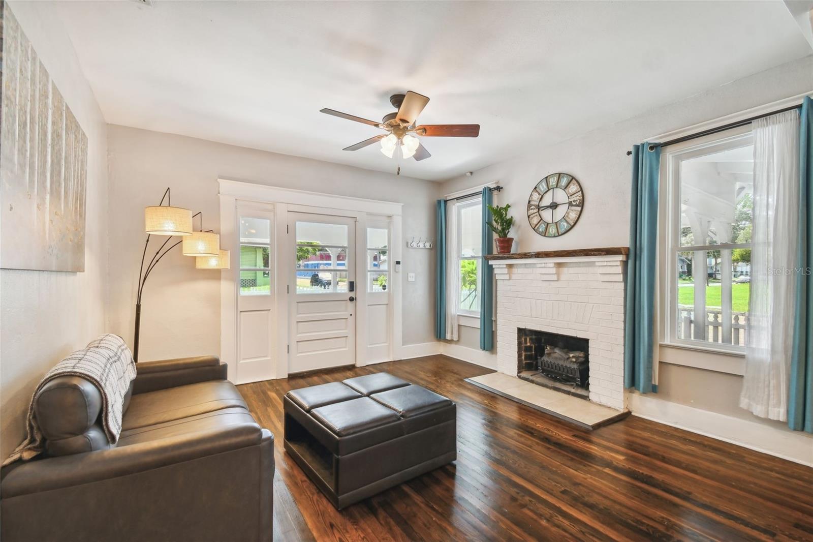 Restored Original Hardwood Floors and Live Edge Fireplace Mantle.