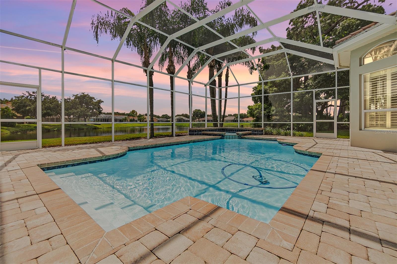 Backyard view - Pond view in the back, pavered lanai