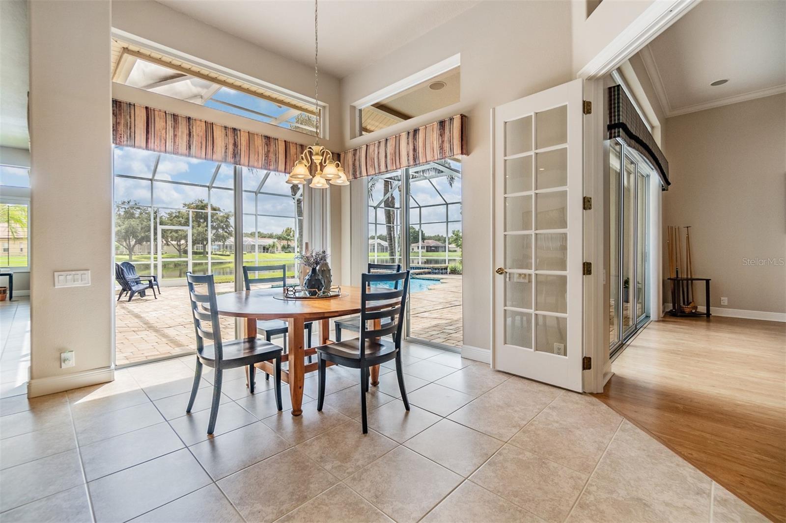 Dinette area overlooking the pool/spa and a pond view