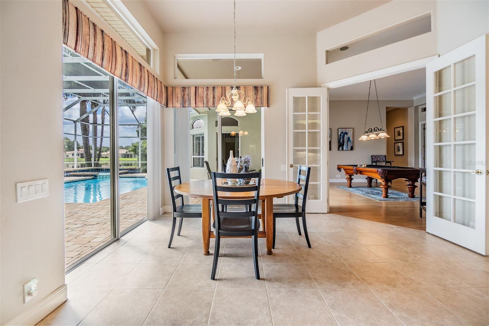 Dinette area overlooking the pool/spa and a pond view