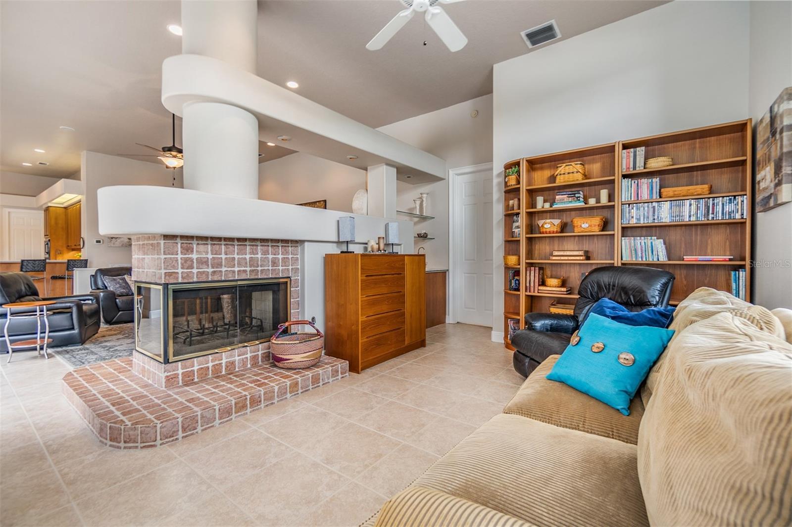 Sun Room/Den and part of the mother in law suite, double sided fireplace.