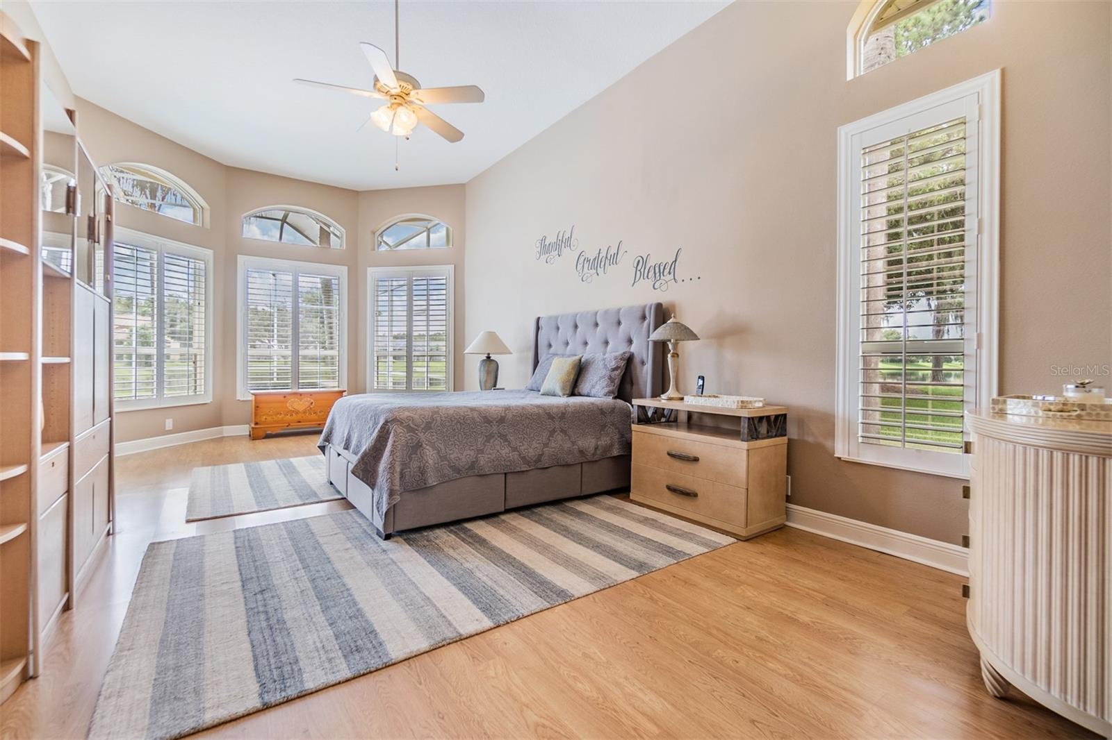 Master Bedroom - Plantation Shutters, Vaulted Ceilings, Pergo Flooring- great views of the pond!