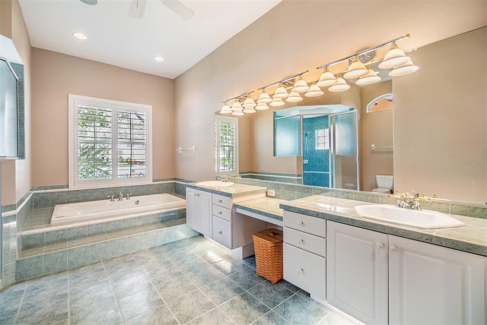 Master Bathroom, Double Vanities, Plantation Shutters, Tile Flooring, Tub and Separate Shower