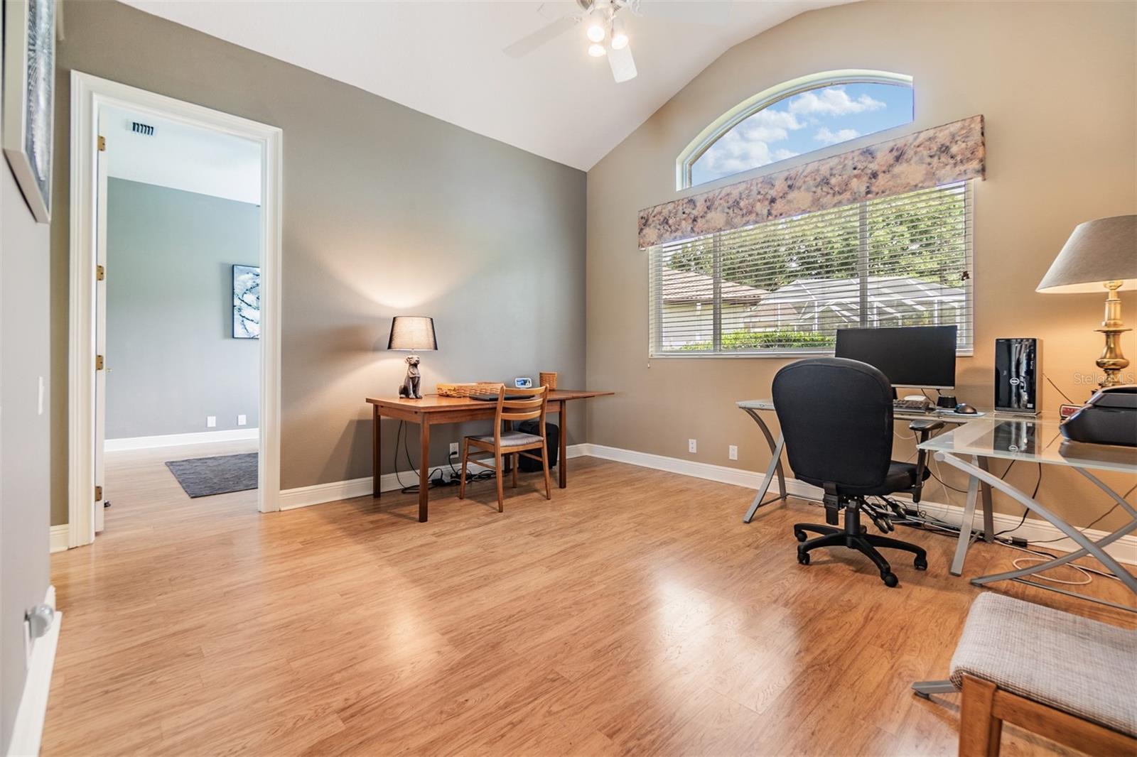 Gameroom/another Office/Den/Sitting area with double doors between two of the guest rooms.  Ceiling fan, Pergo Flooring and lots of natural light.