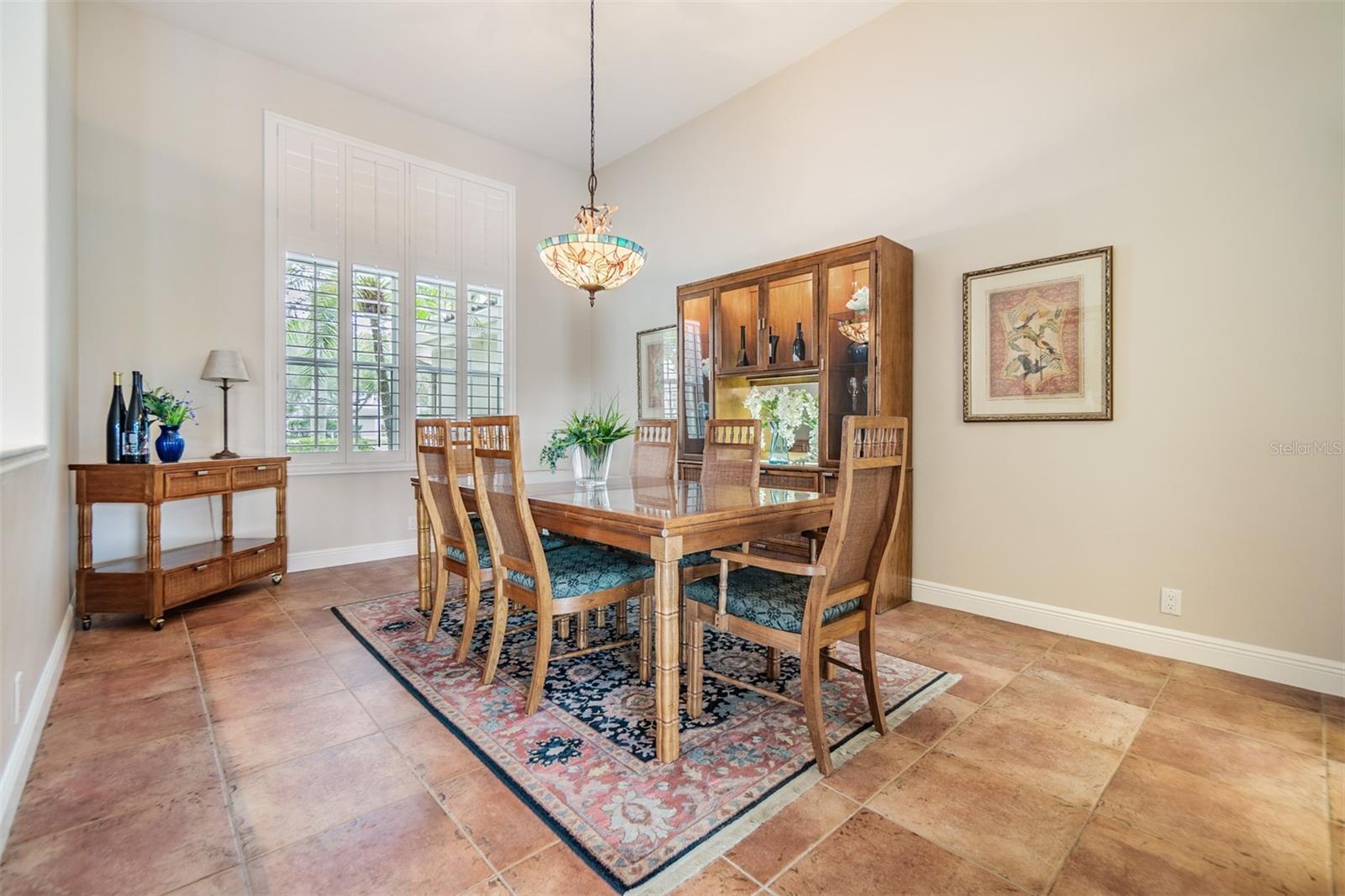 Dining Room, Tile Flooring, plantation shutter, 12 foot ceilings.