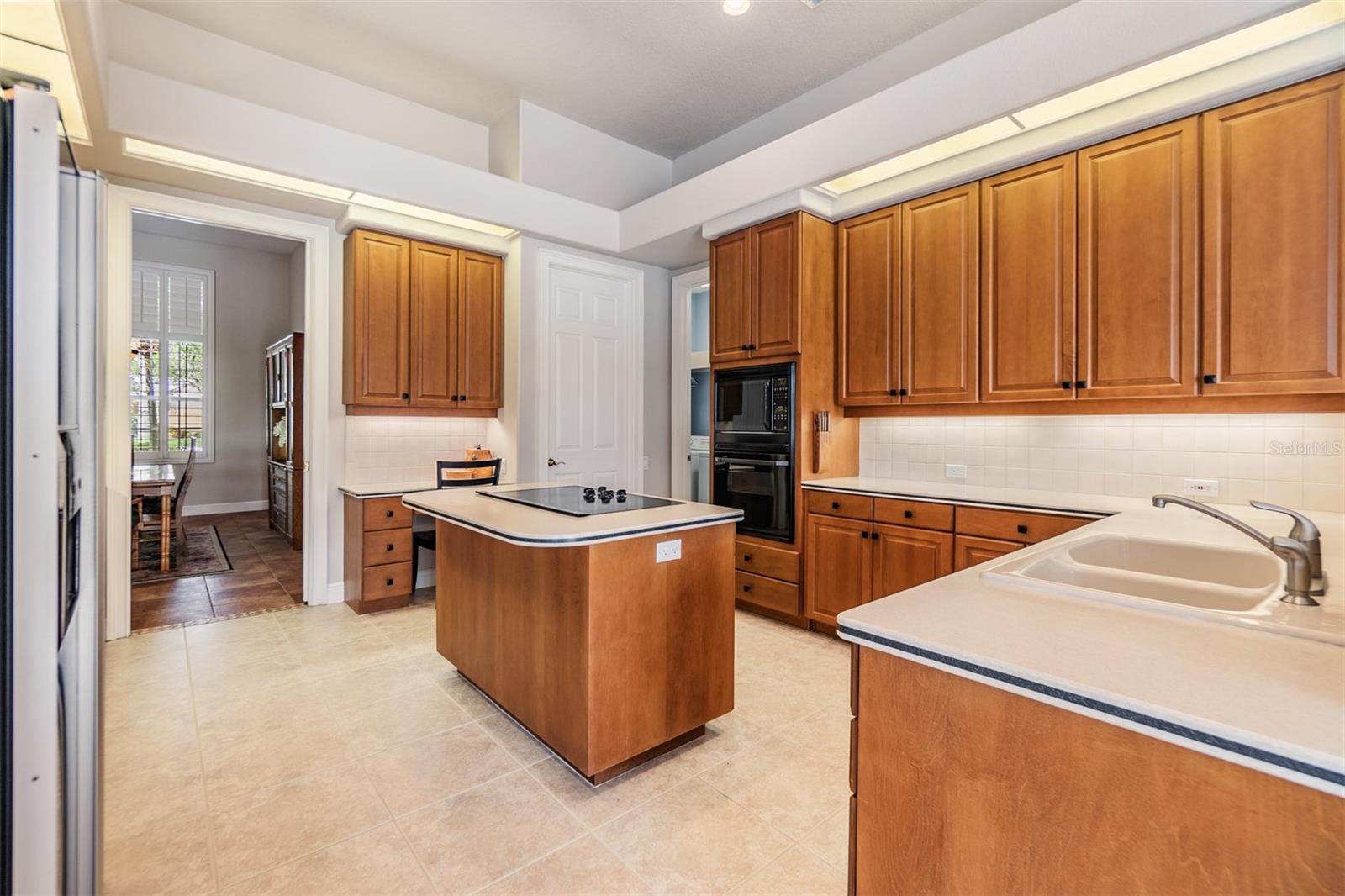 Open Kitchen, 12 ft ceilings, Tile Flooring and inset lights.