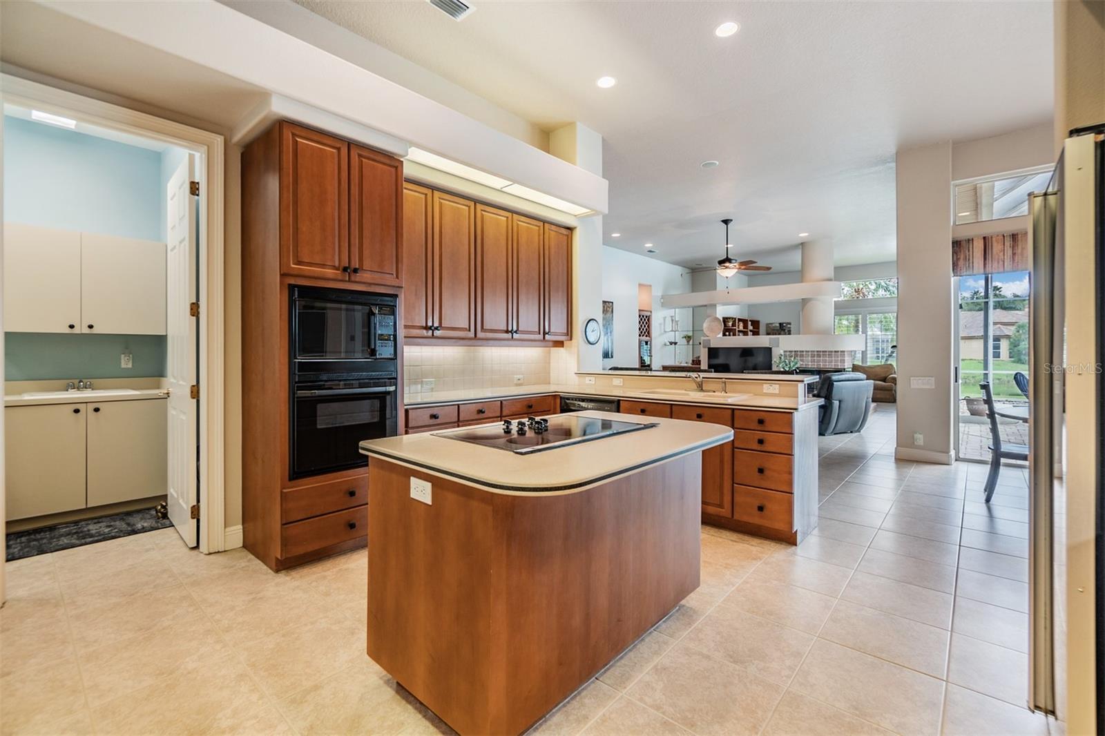 Open Kitchen, 12 ft ceilings, Tile Flooring and inset lights.