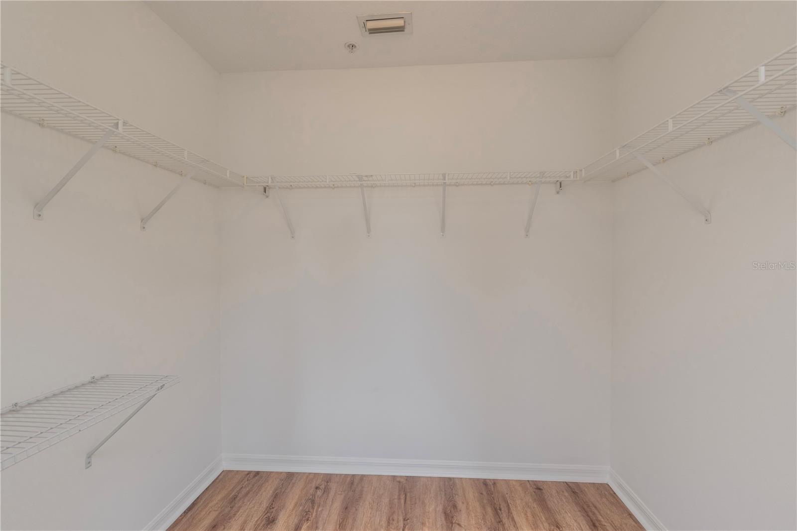 Primary bedroom walk-in closet.