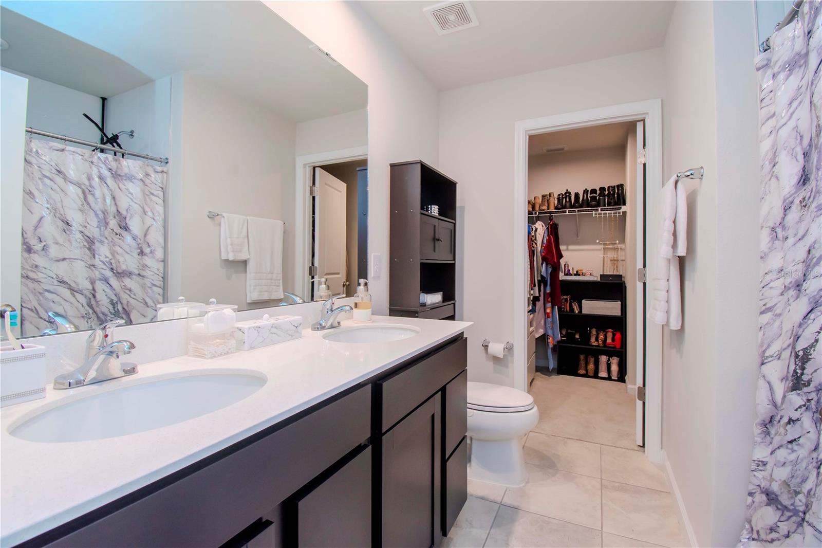 Primary bath leads to generously sized walk-in closet