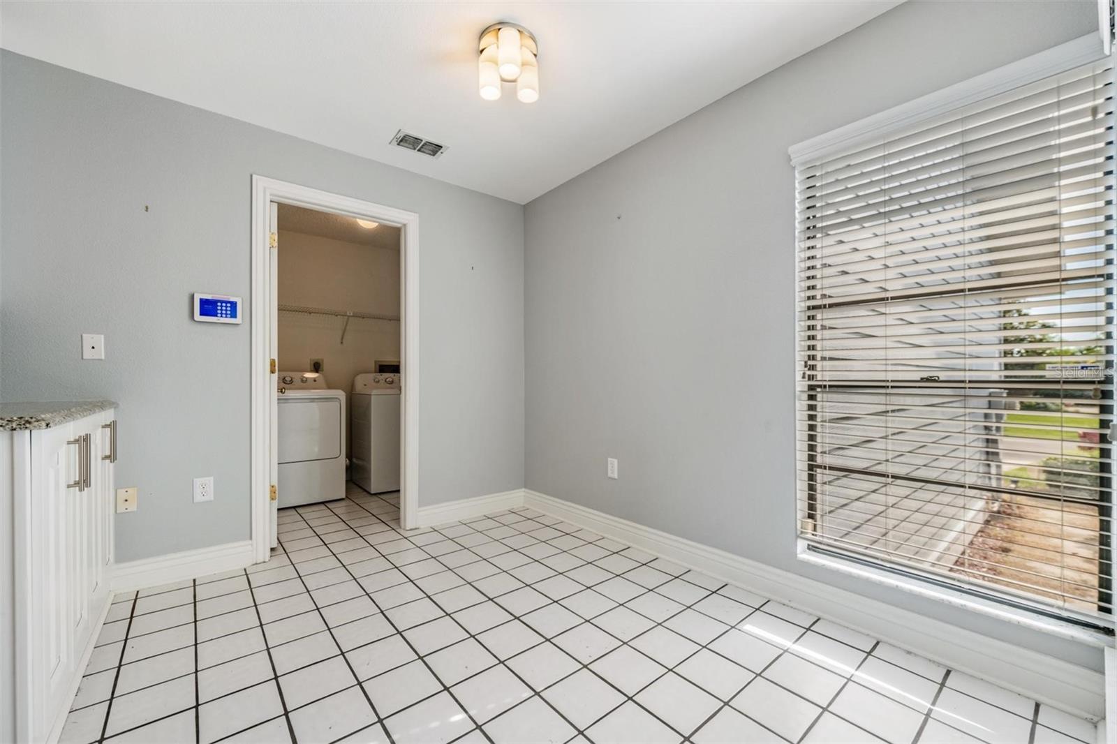 Breakfast area doorway to laundry room and garage