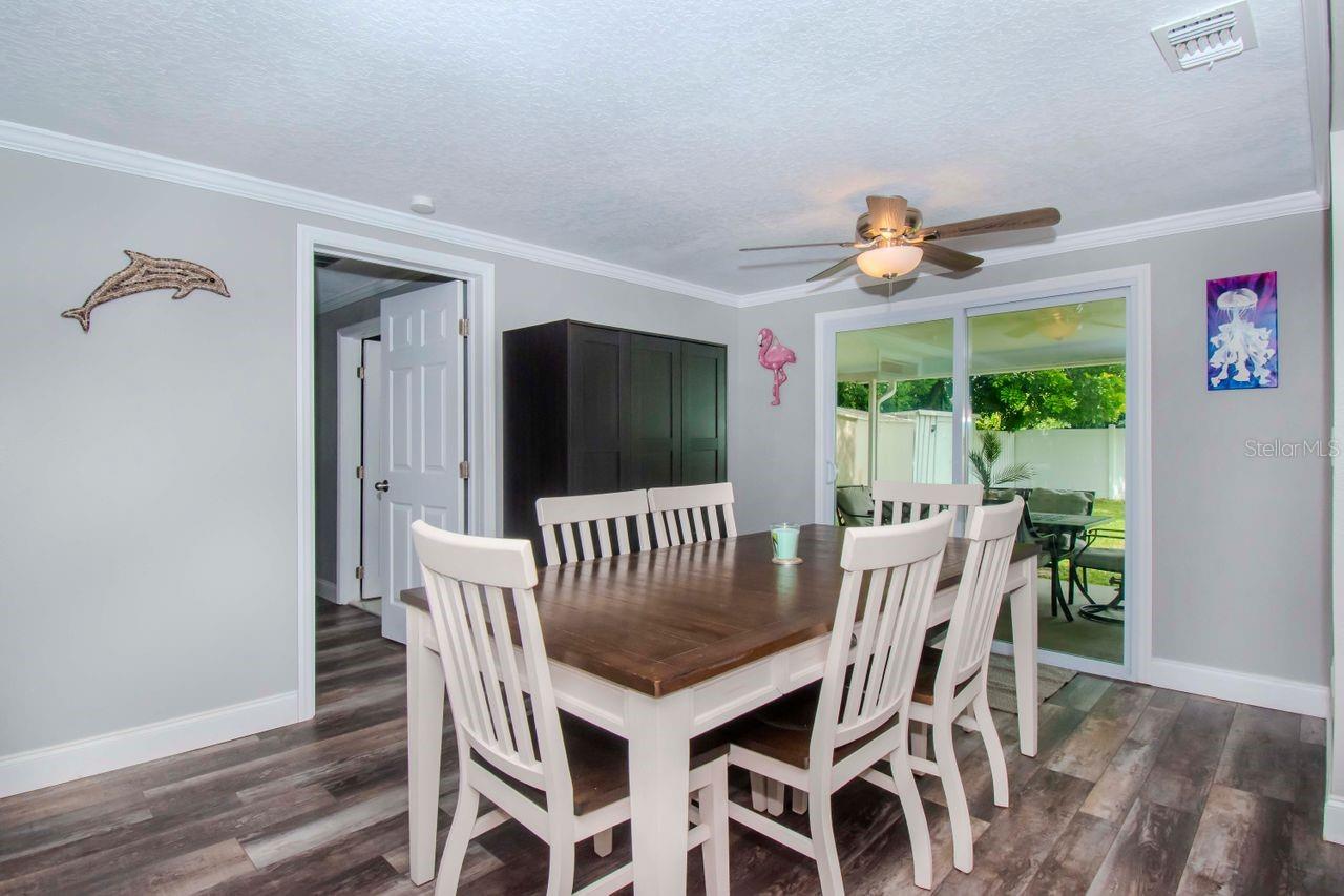 Dining area off kitchen that leads to patio