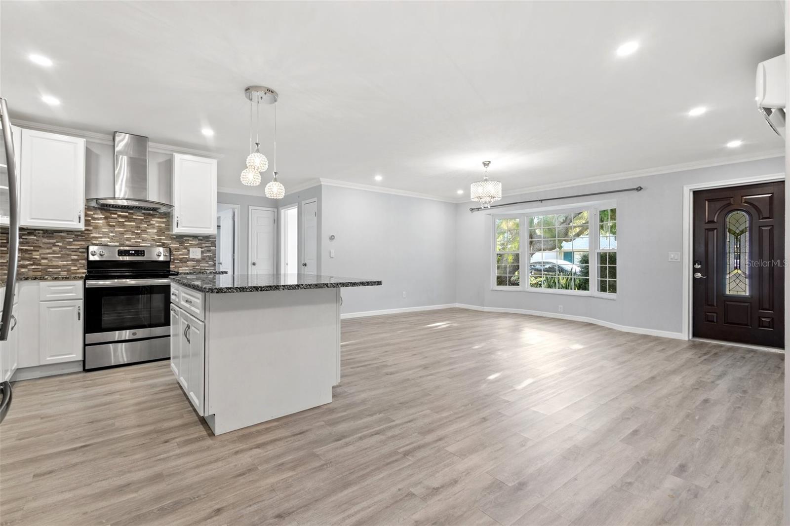 Kitchen and great room, showcasing beautiful bay window