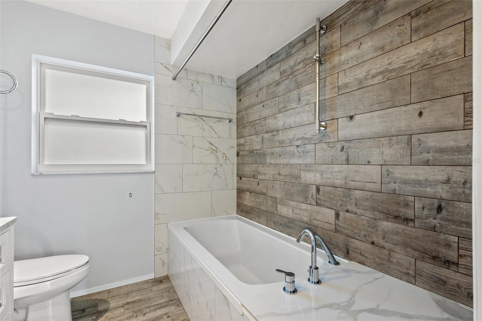 Beautifully remodeled bathroom 2 with shower/tub option