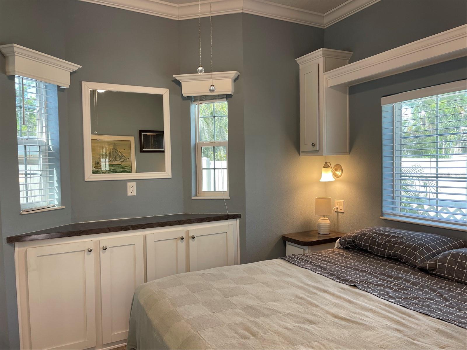 Valances,crown molding in bedroom add sophistication to the decor.