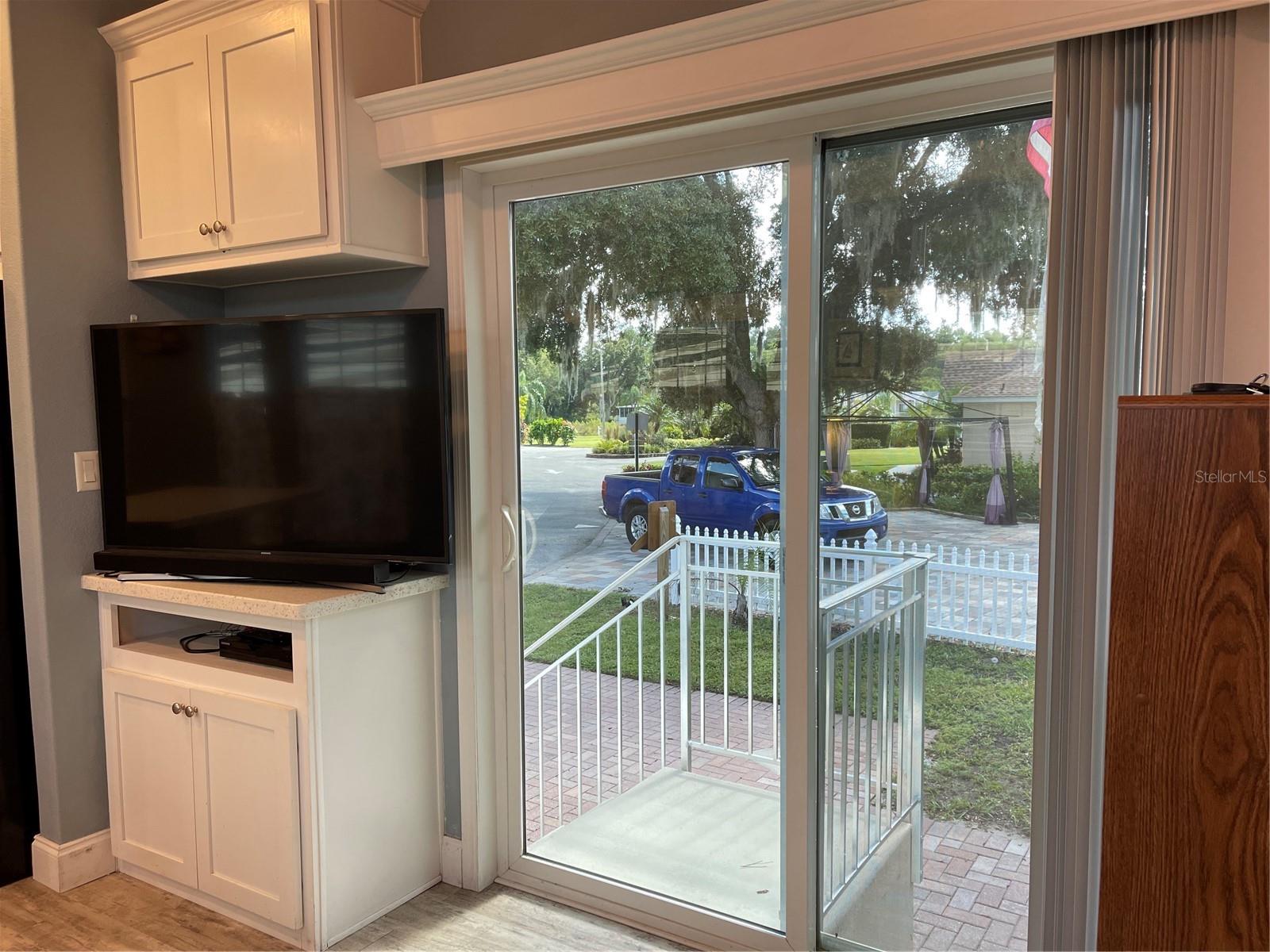 Sliding glass doors lead out to the South West side of the home.