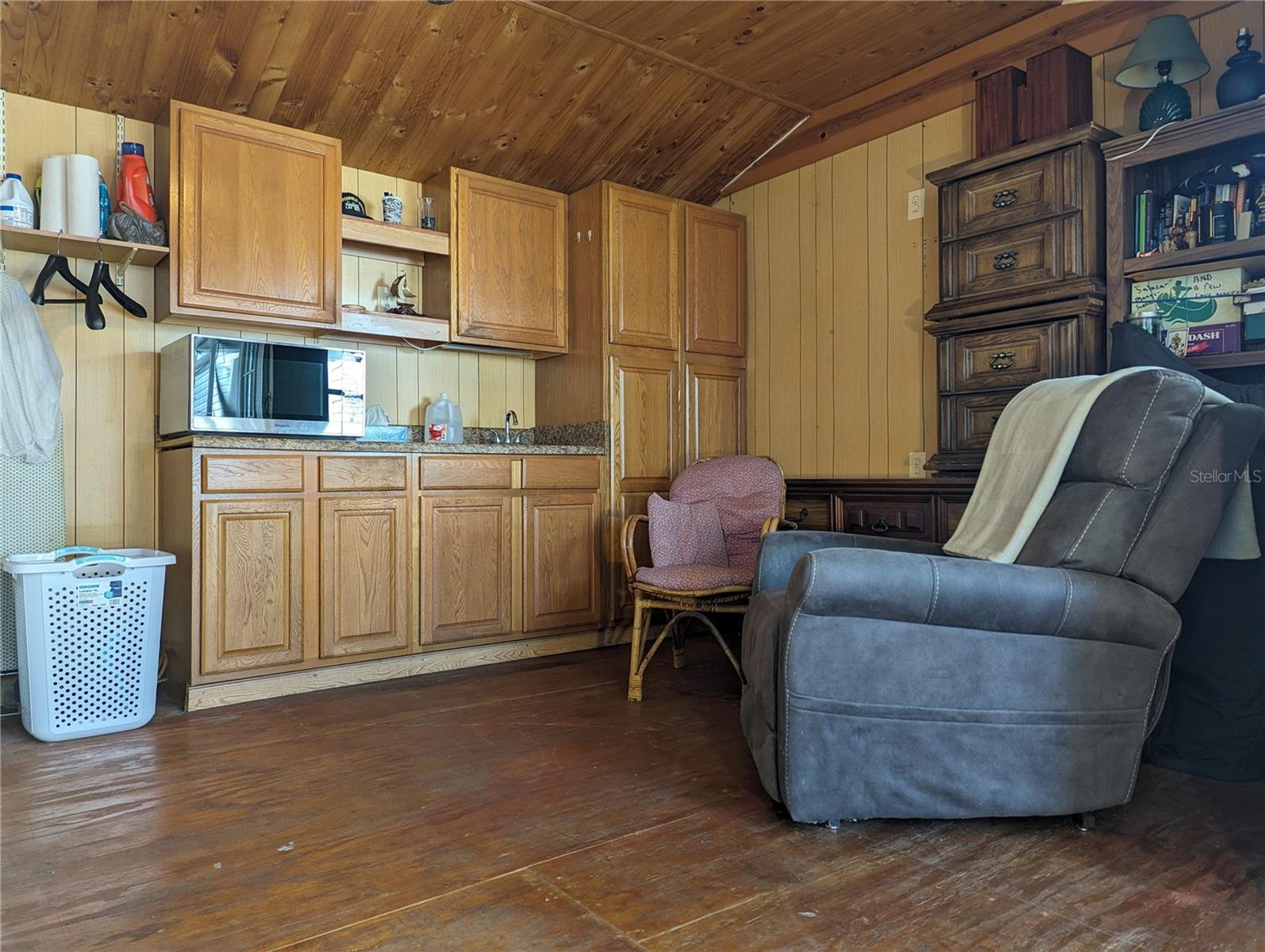 Cabinets were installed in workshop with a sink that provides water.