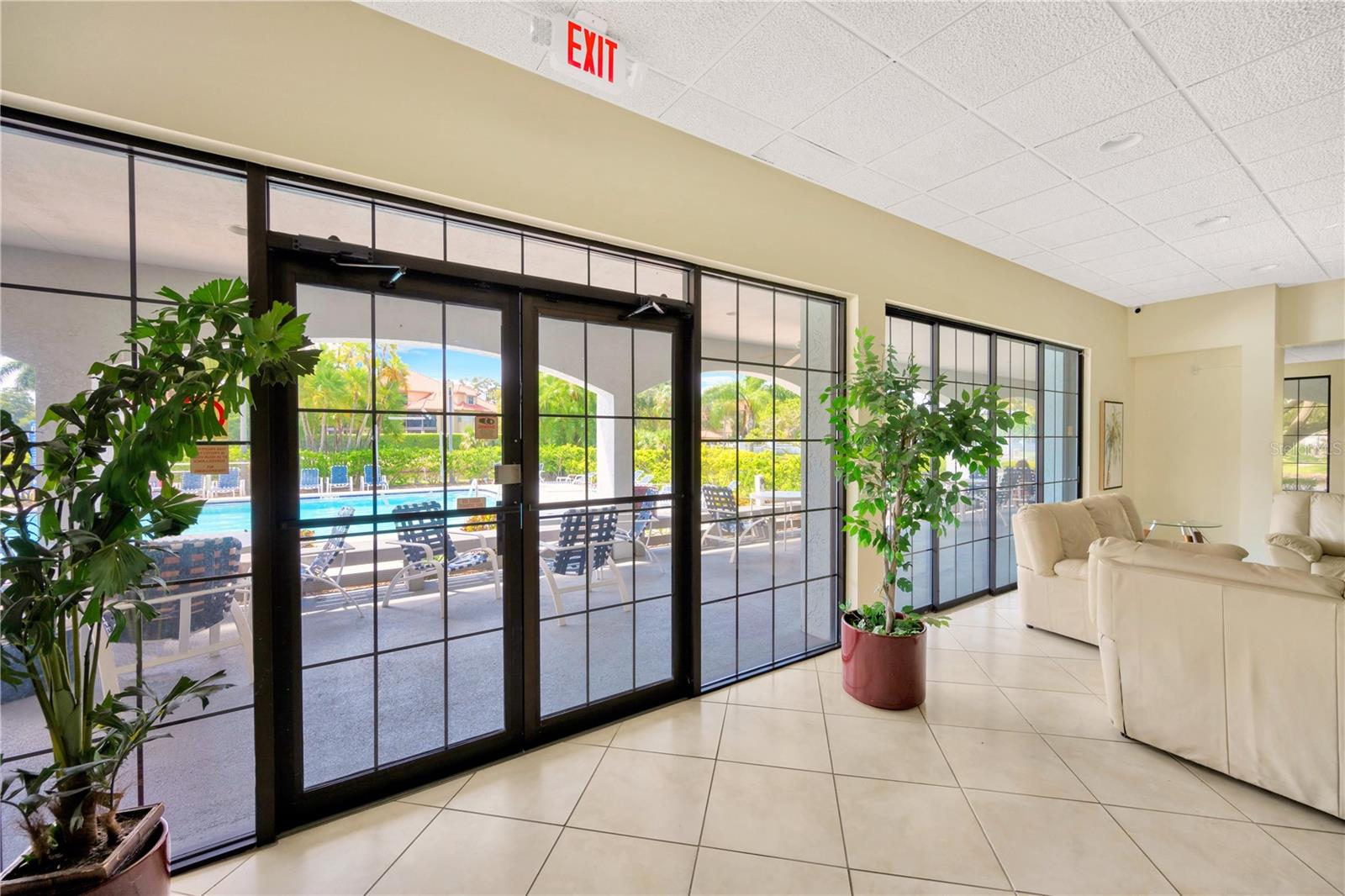 Atrium access to promenade overlooking ponds and lit fountains