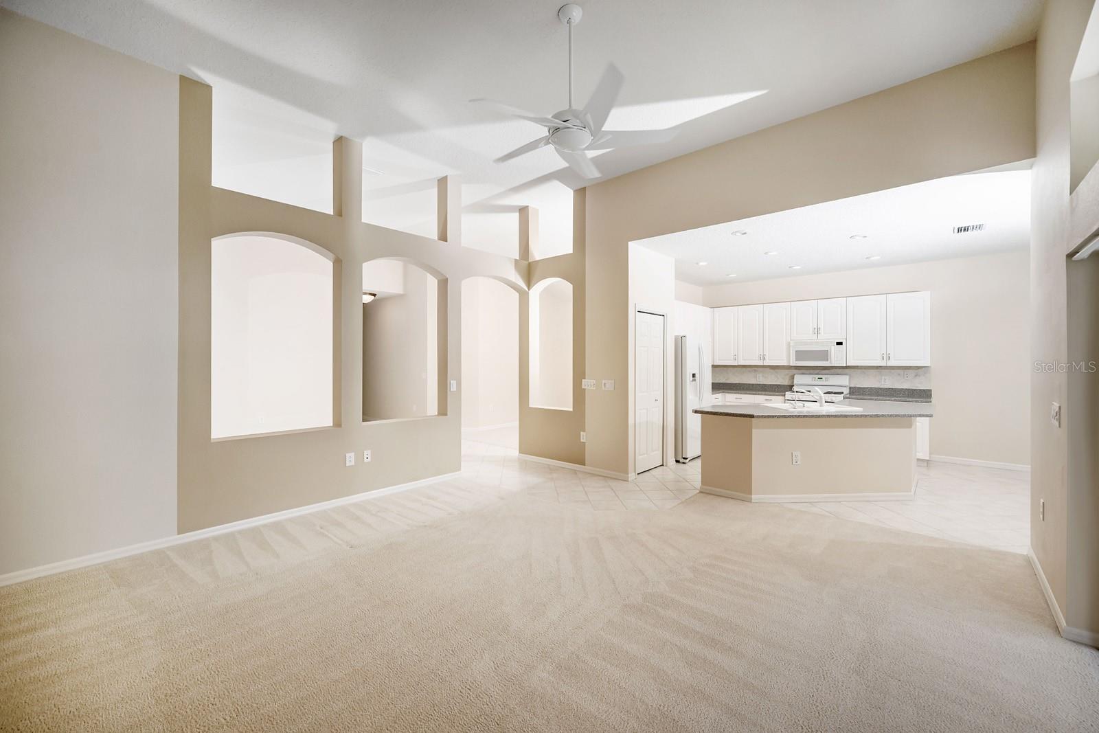 Family room view from main bedroom. Great natural lighting, new ceiling fans