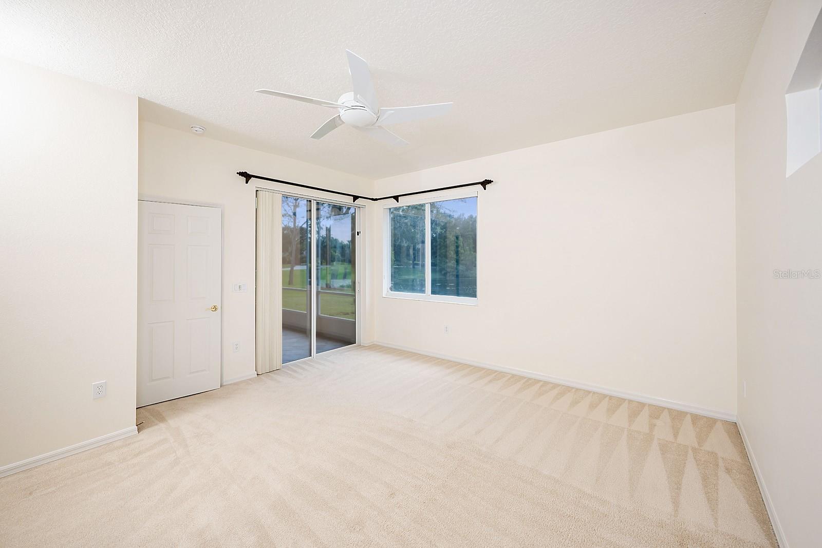 Main bedroom with slider entrance to rear lanai.