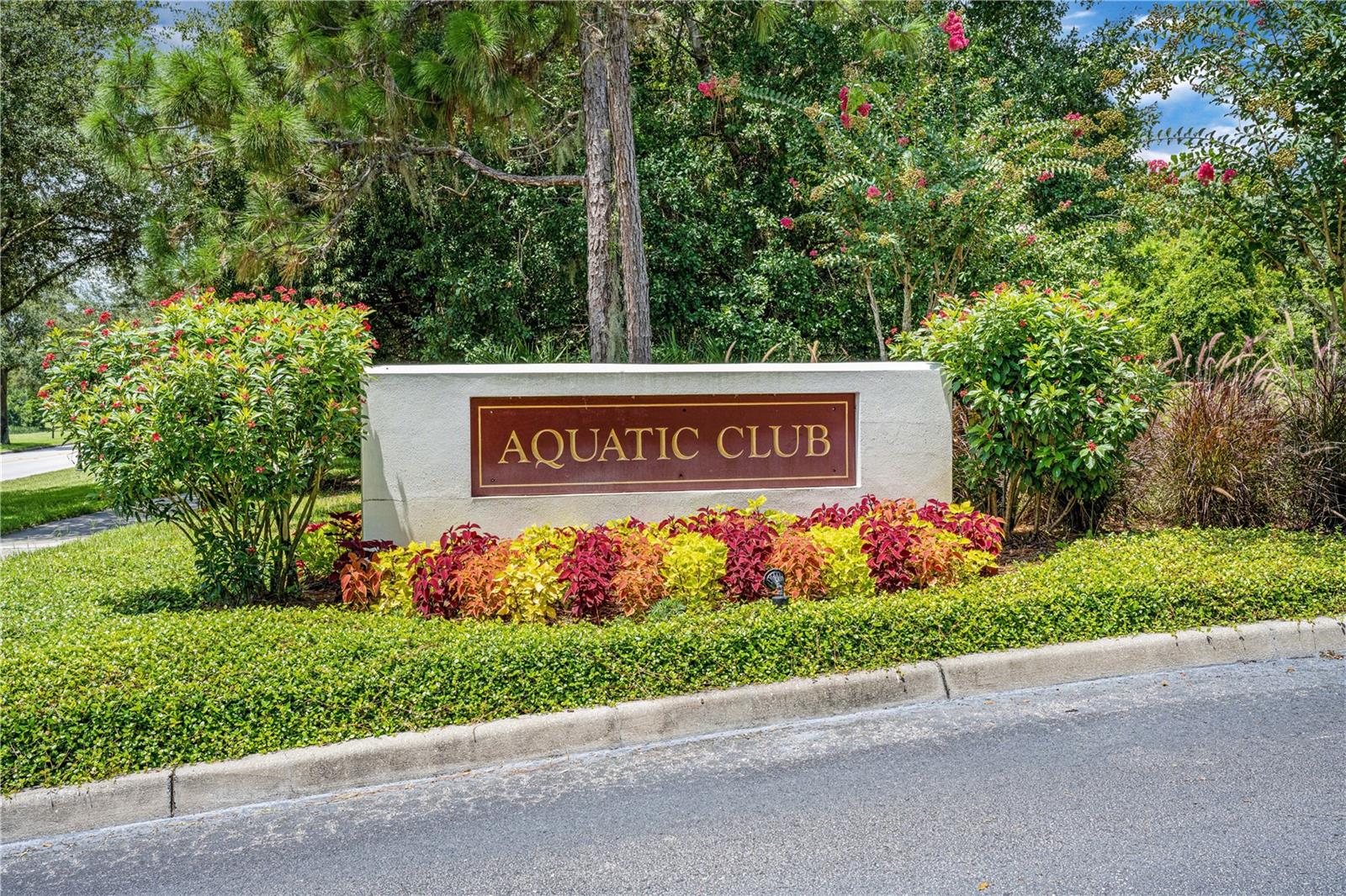 Aquatic Center with splash pad, water slide, and lap pool