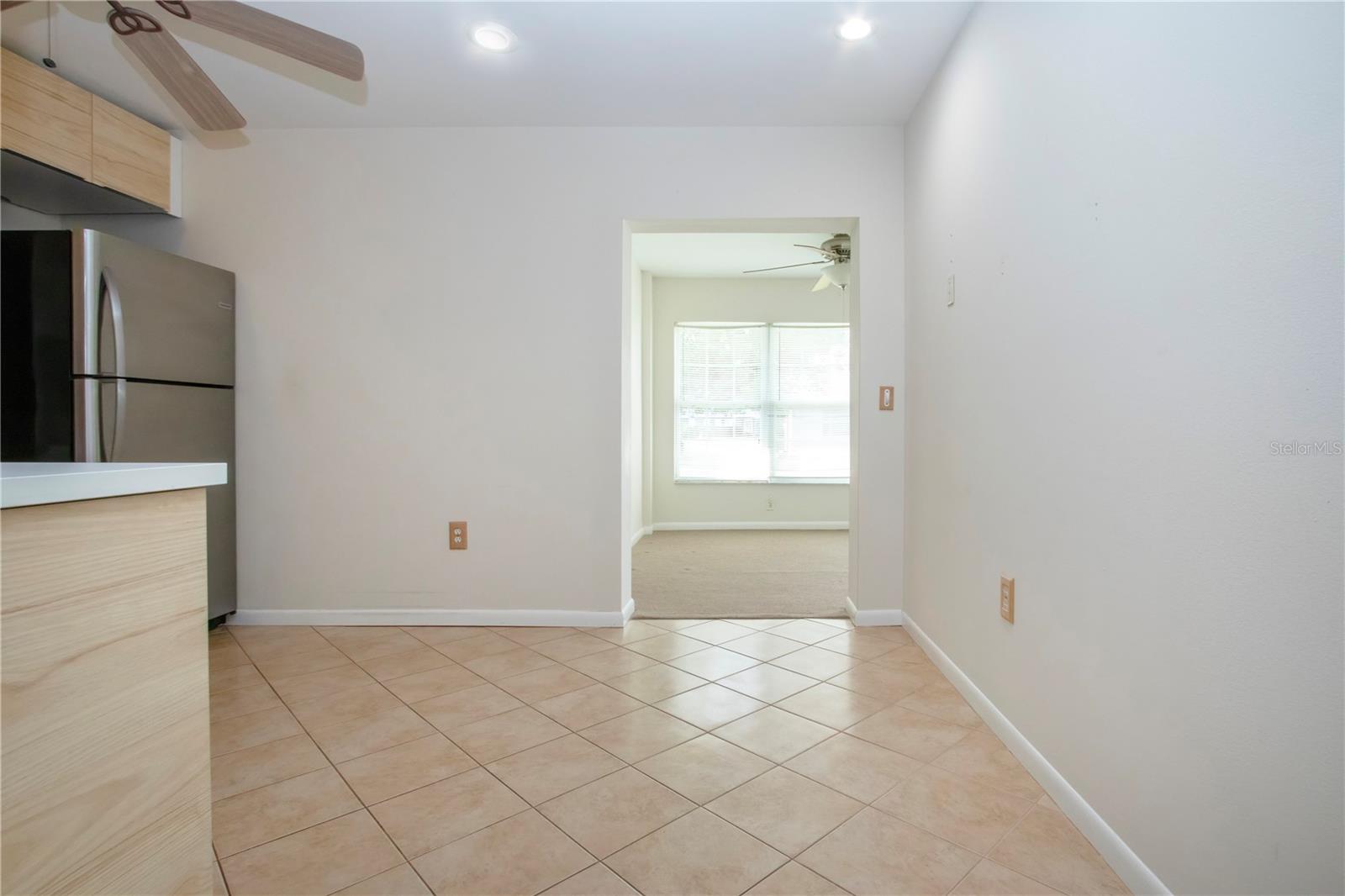 Kitchen located between living room and family room