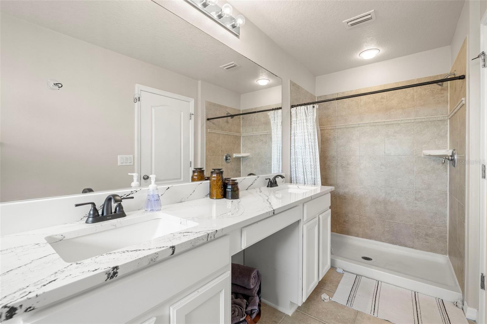 Primary Bath En Suite! Walk in Shower, Dual Sinks with New Quartz Counters!