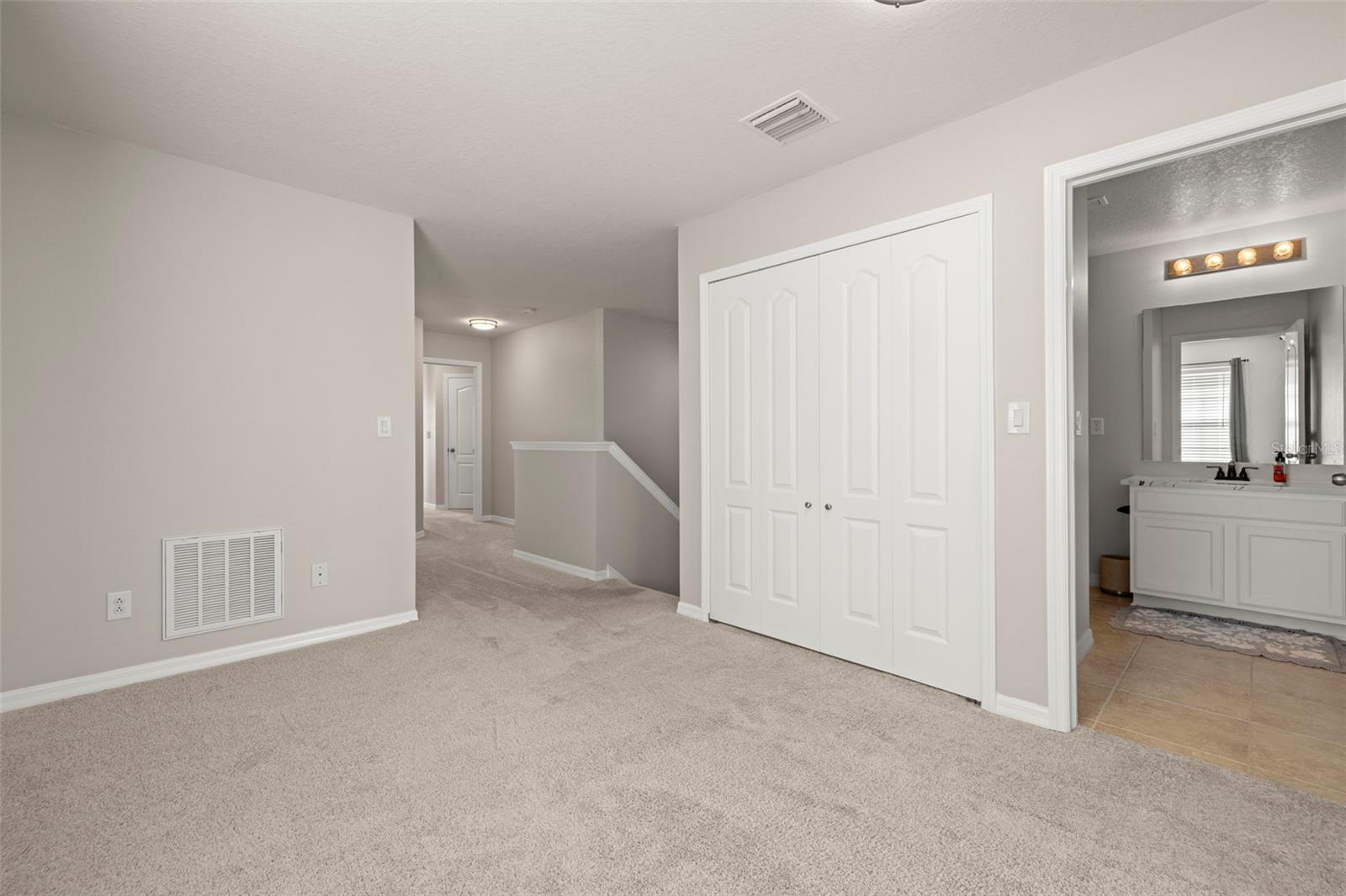 Bonus Room looking into Guest Full Bath and where the Steps are located