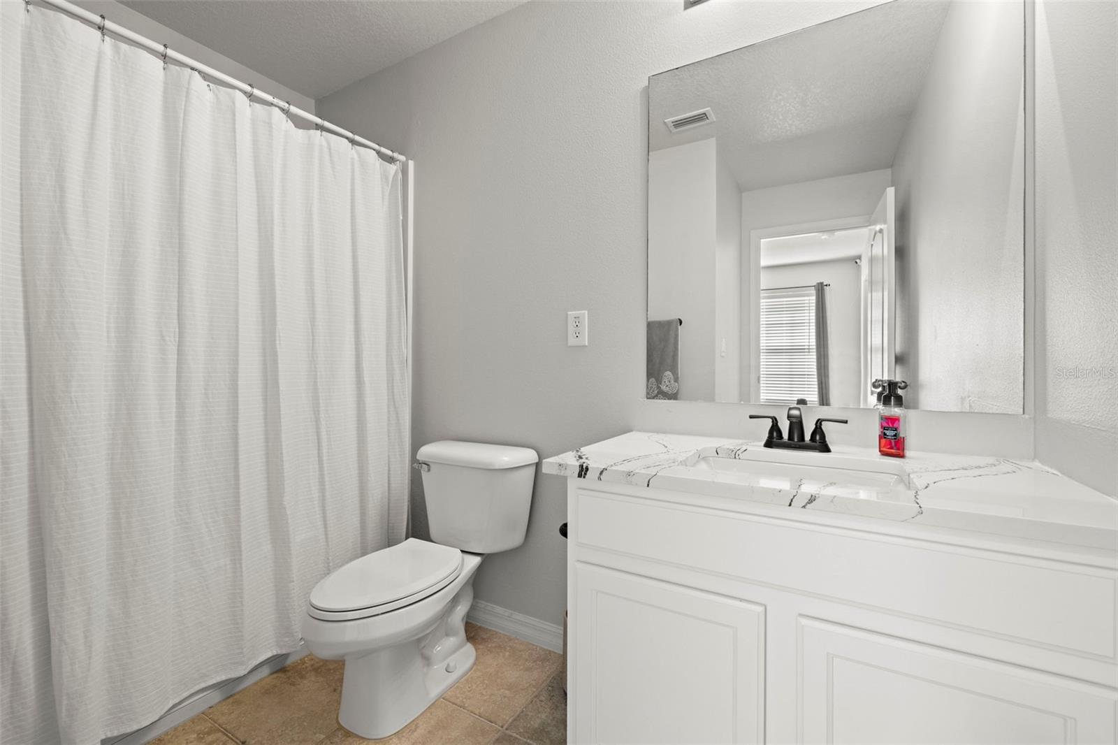 Guest Full Bath upstairs!  Remodeled with Quartz!  Stunning!