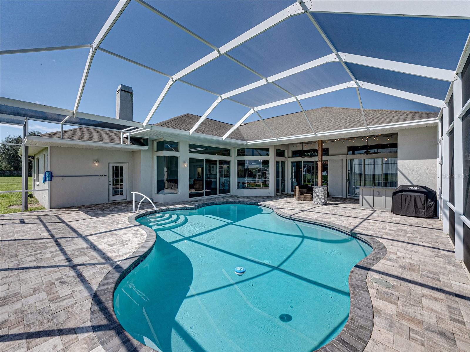 Pool with view of back of home