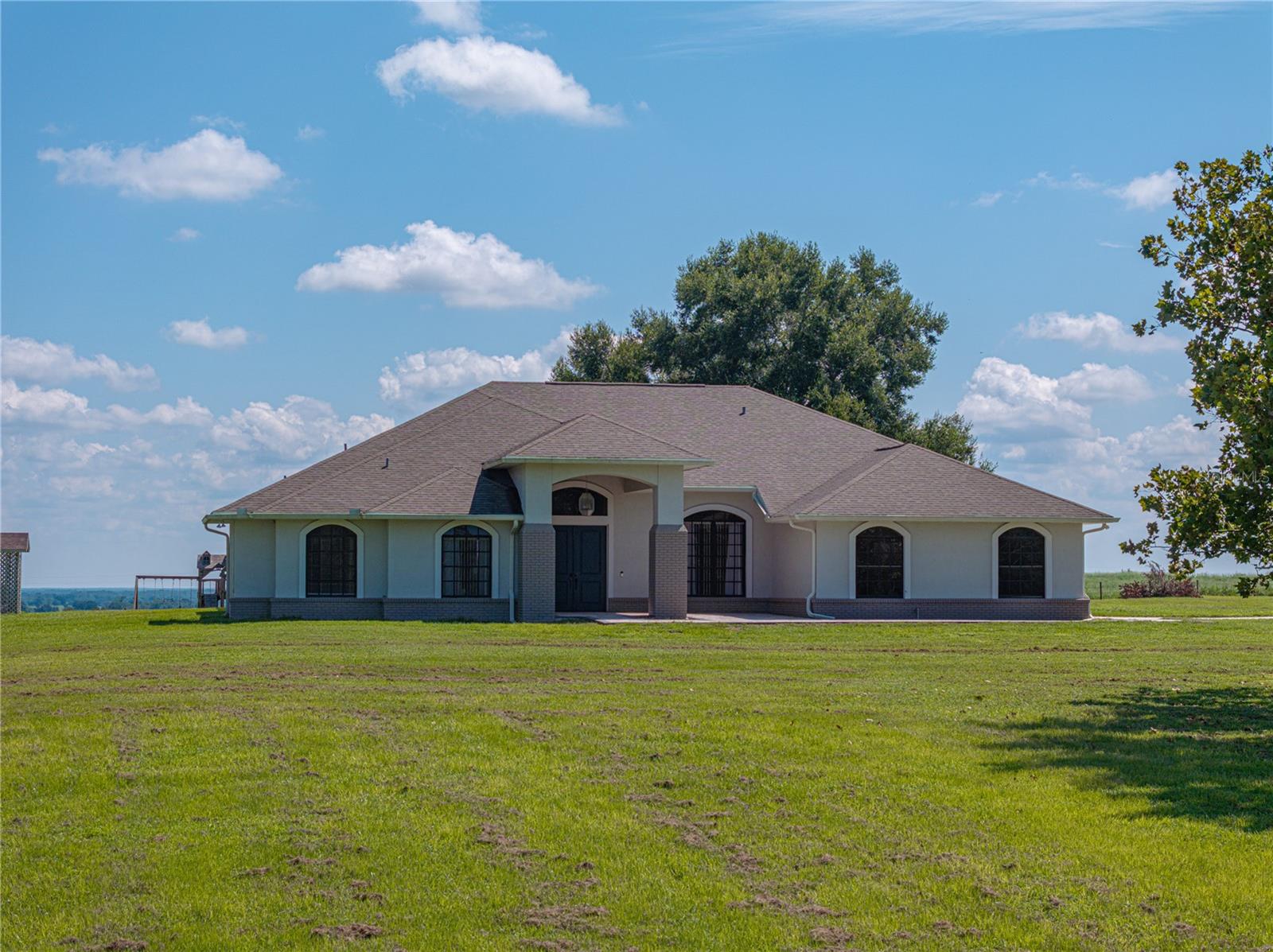 Face of the hilltop home with valley visible on the left