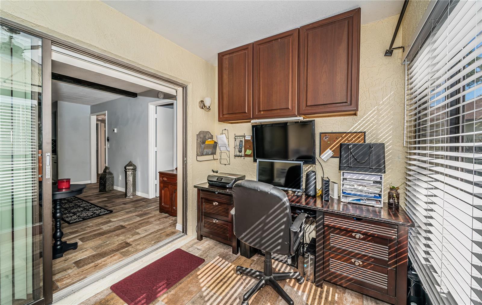 Tile floors, desk & built-in upper cabinet