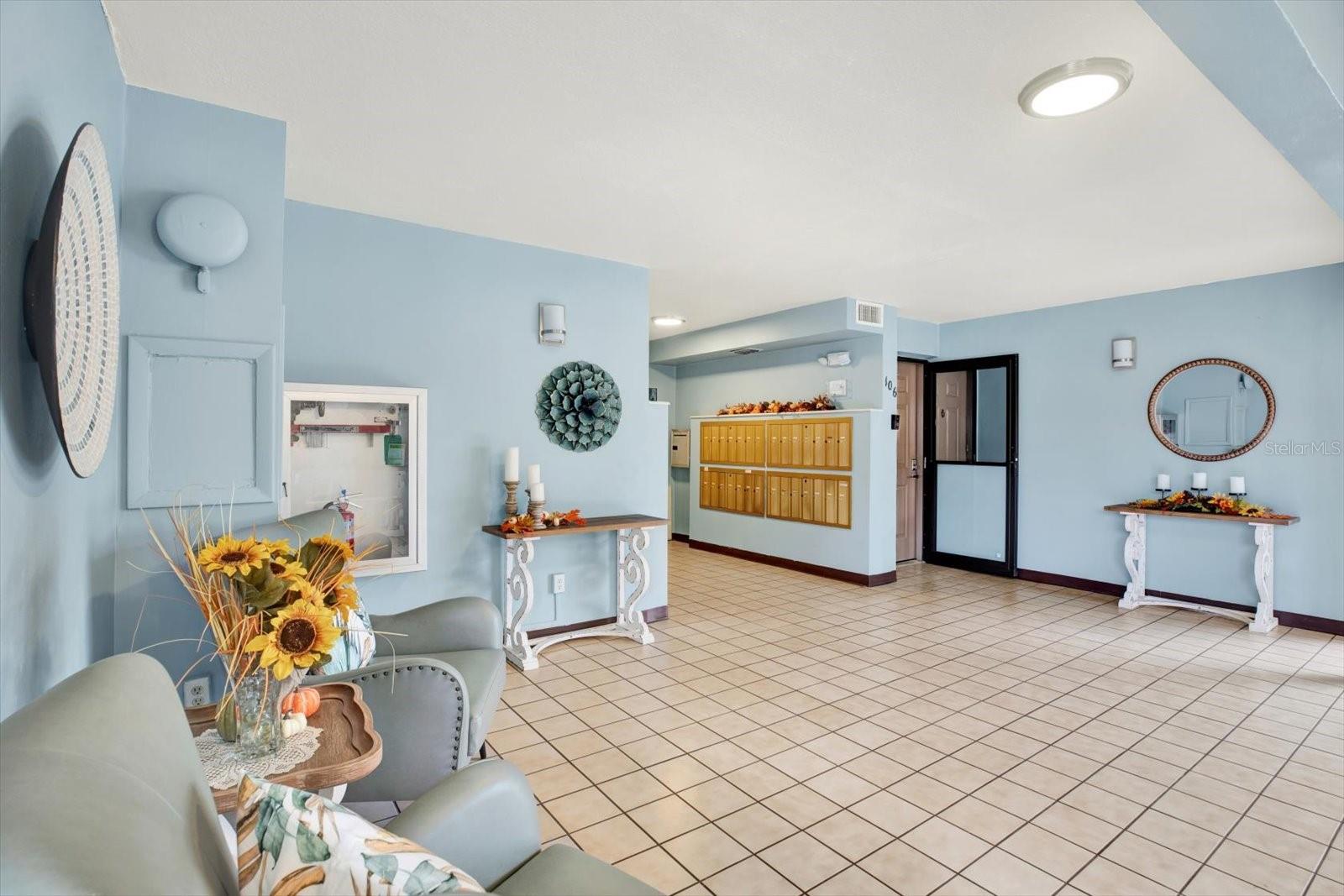 Lobby with secure access and unit front door. (Lobby floors being replaced Jan 2025).