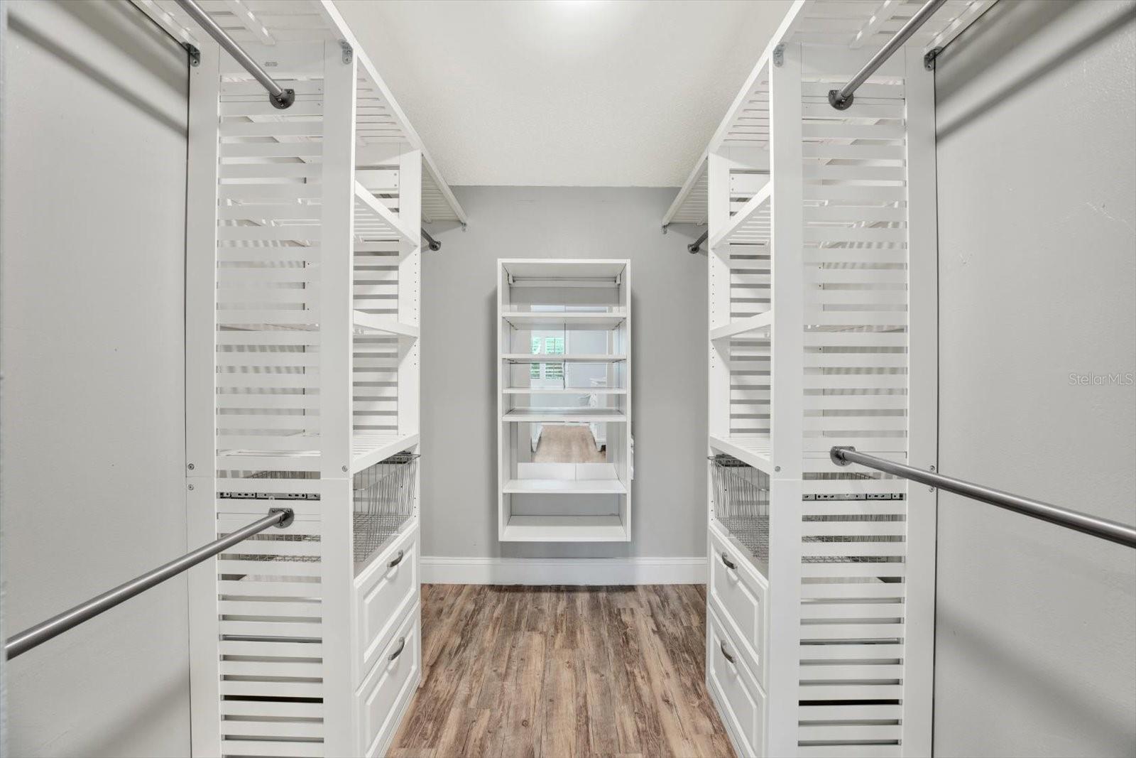 Primary bedroom walk-in closet