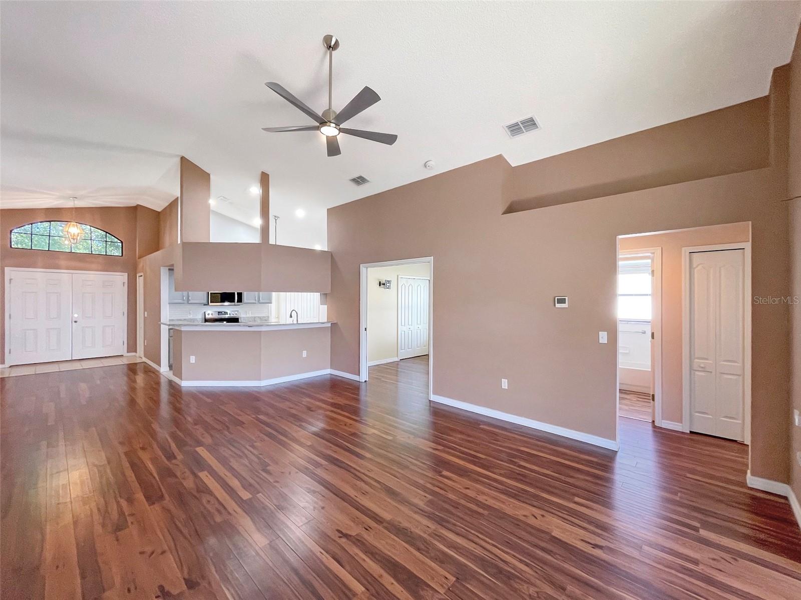 LARGE OPEN LIVING SPACE WITH VAULTED CEILINGS