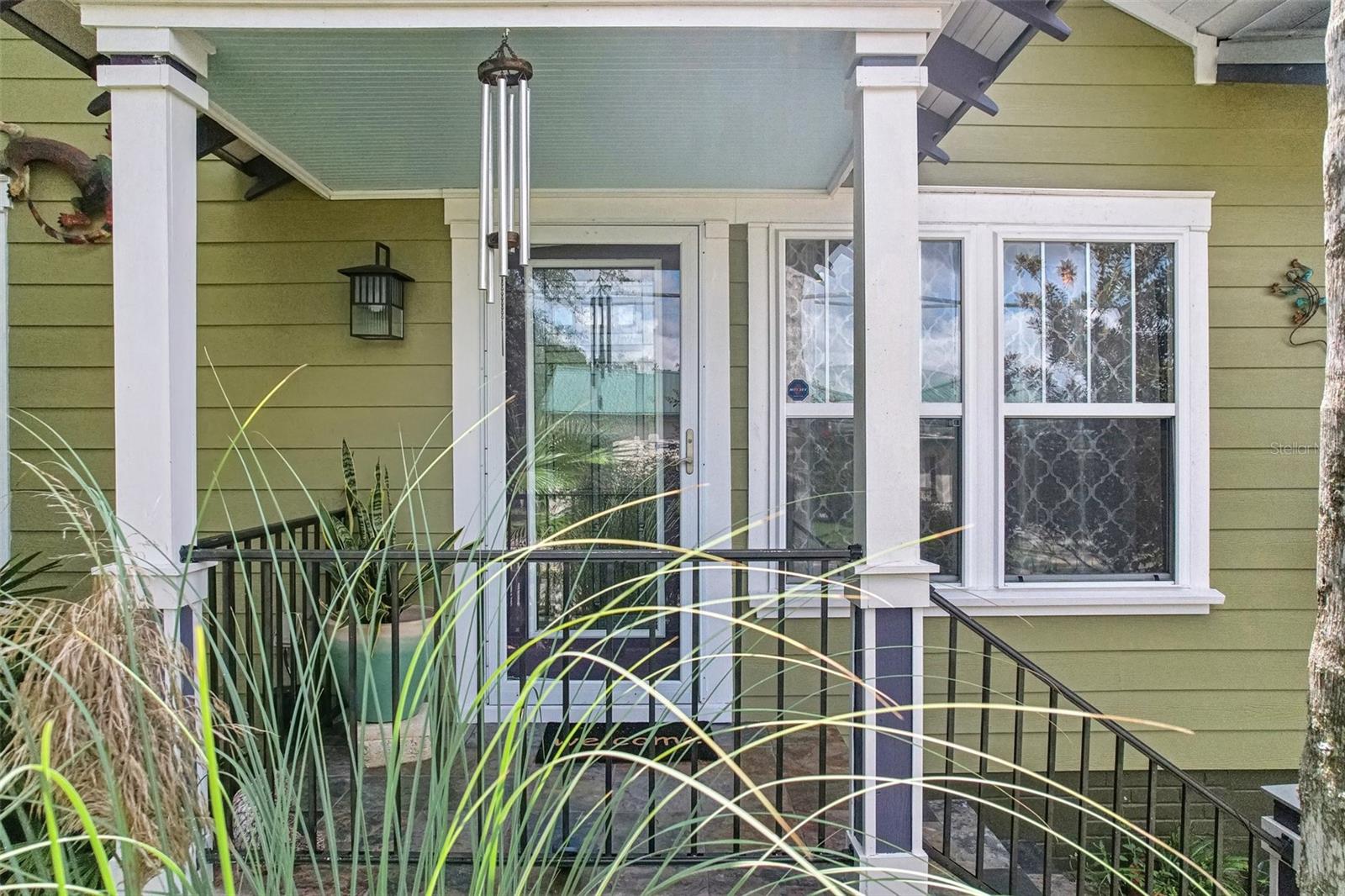 Lead glass entry door behind this all glass door