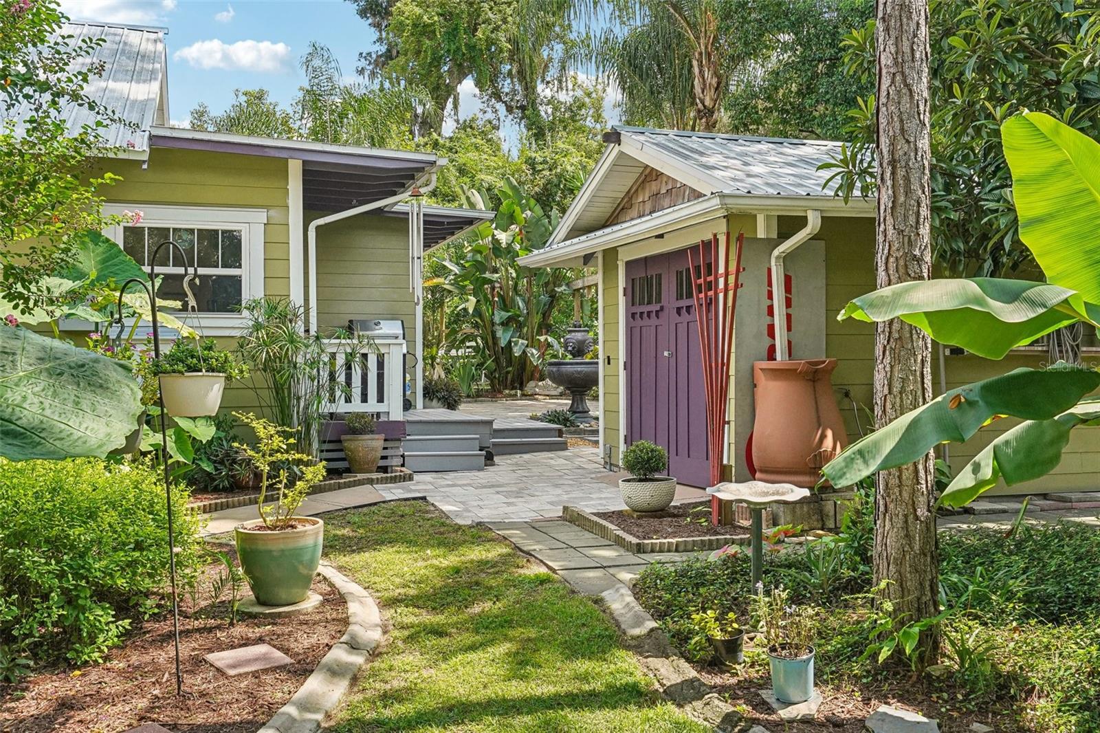 detached workshop with rain barrel