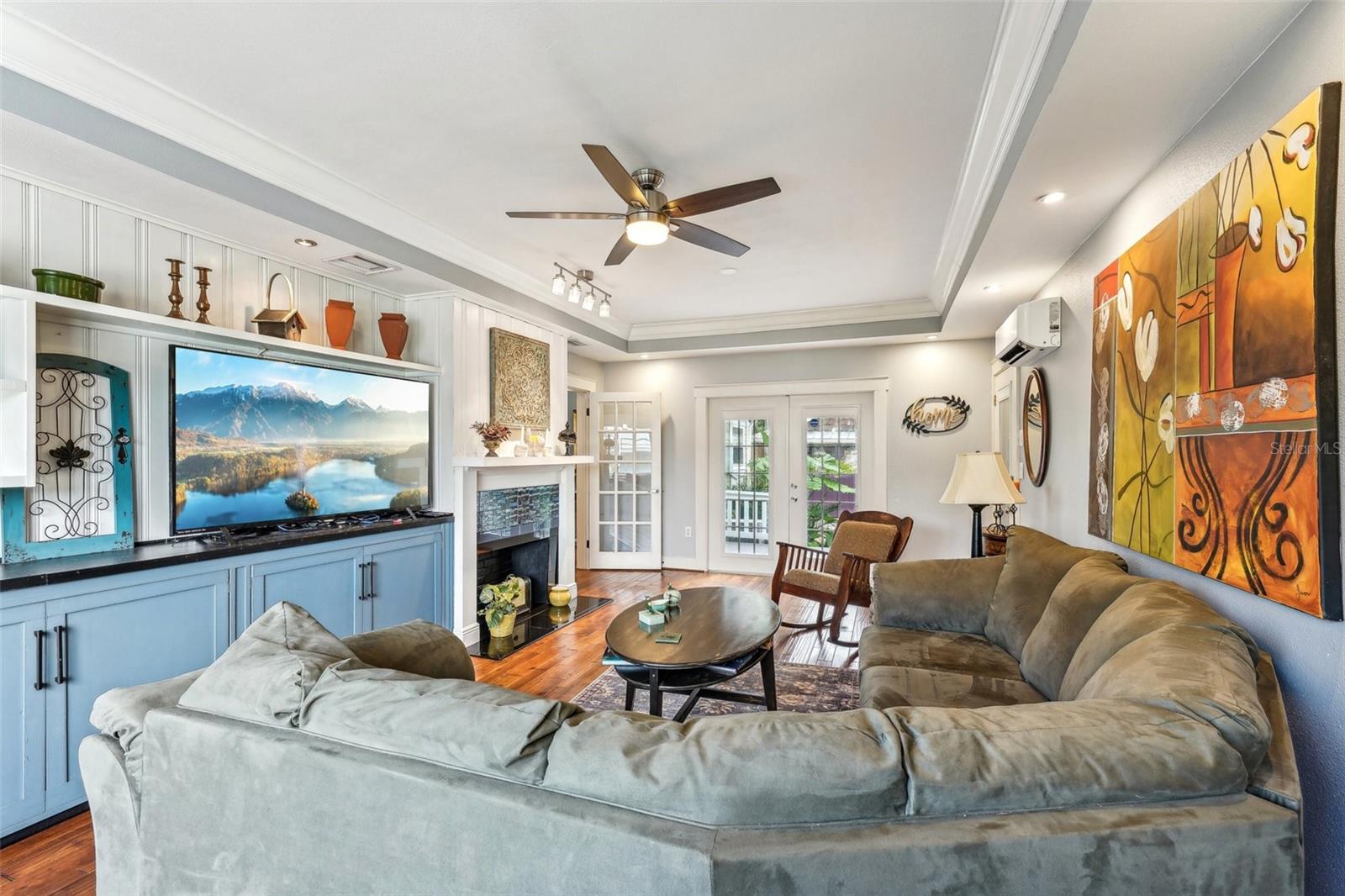 Family room with double french doors out to the backyard and decking.  Built in's and so much attention to detail