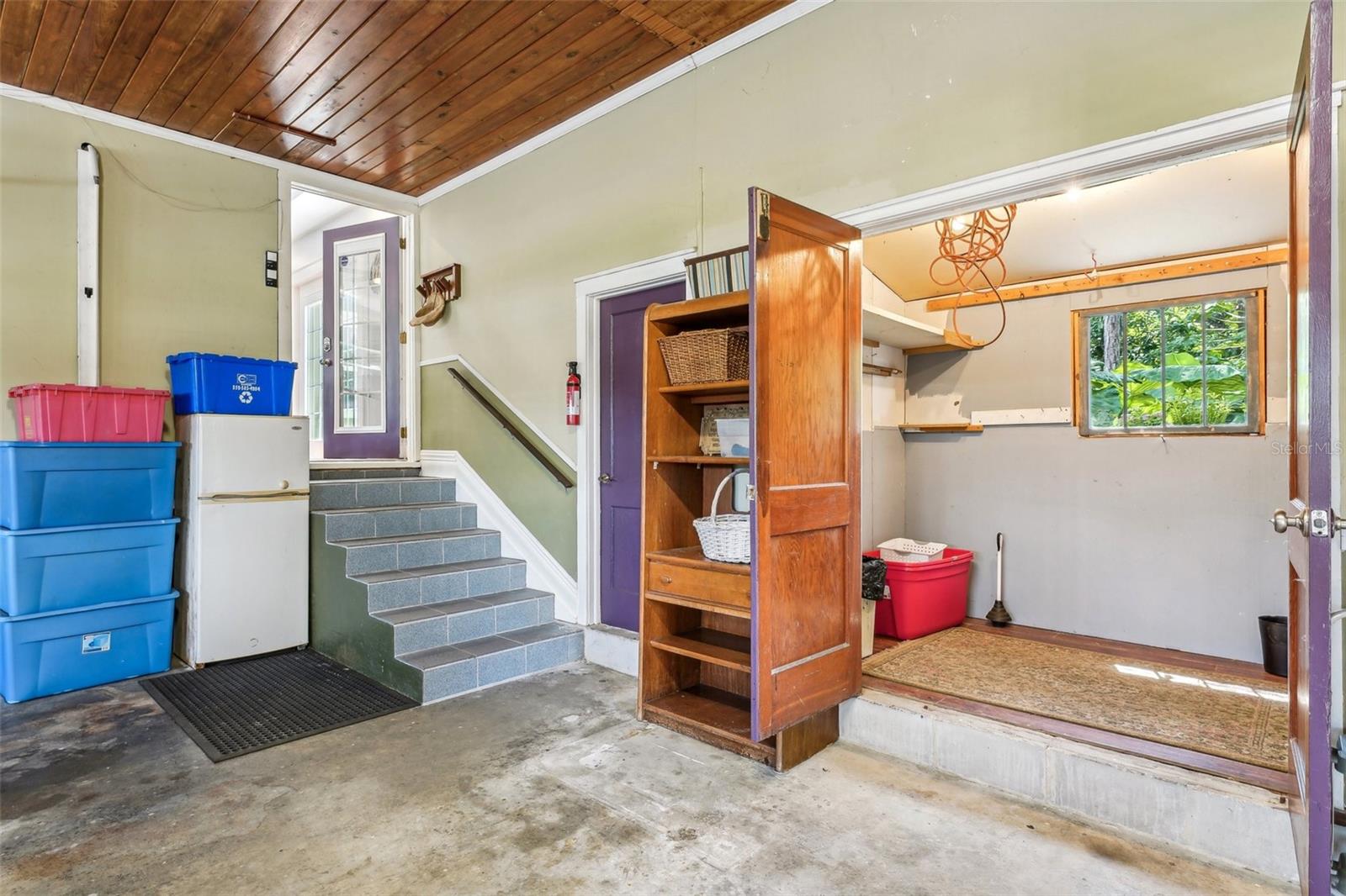 Entry through attached garage to family room.  Extra storage space in garage.  Door to out back as well as a door to the side yard.