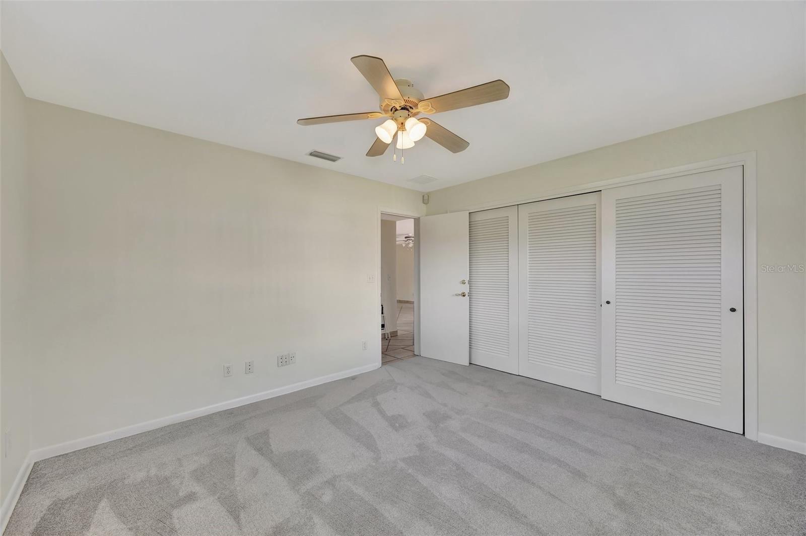 Bedroom with large double closet