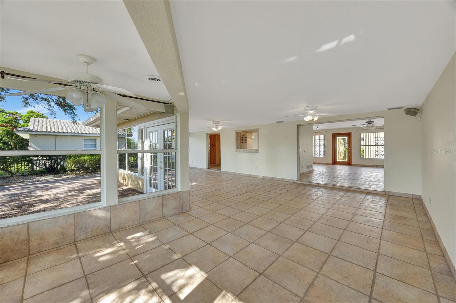 Large Florida/SunRoom open to house and leading out to the backyard