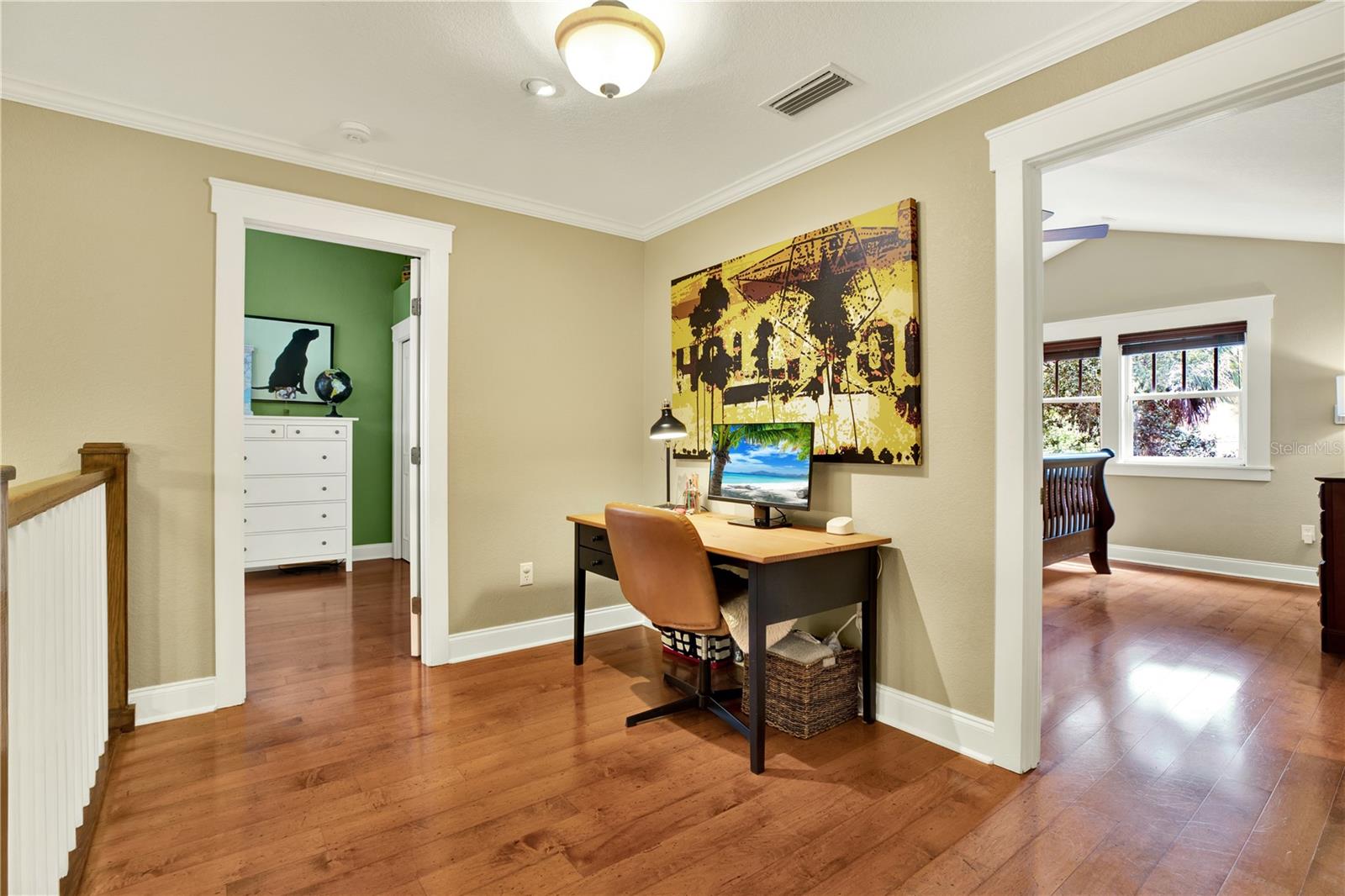 The gorgeous wood floors continue through the upper level